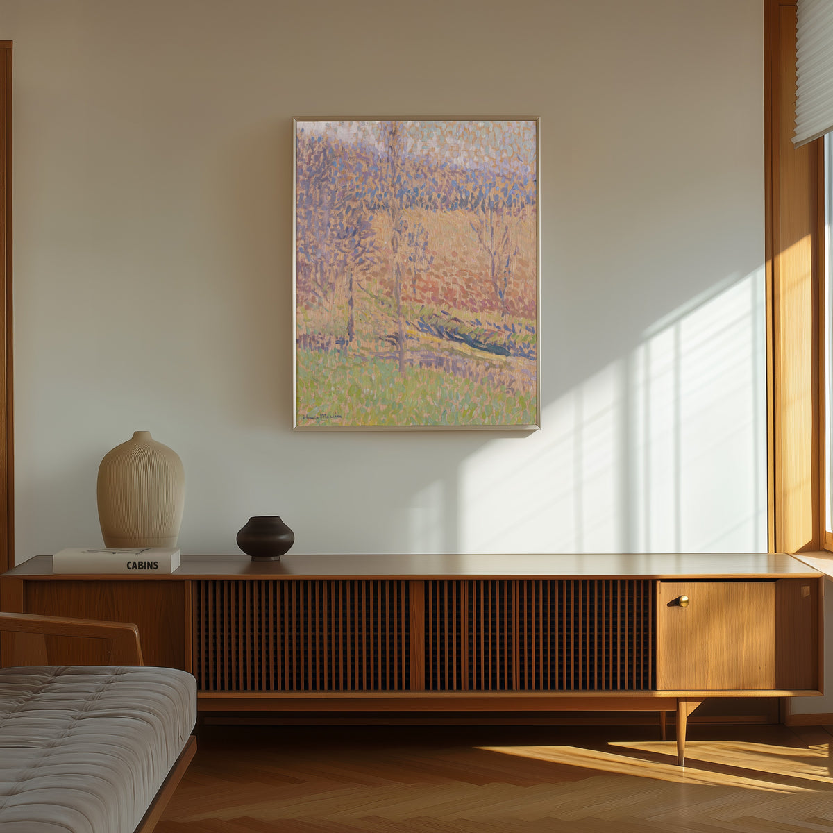 Framed art print of Dans le Brouillard by Henri Martin, in a thin light frame on a sunlit wall above a wooden sideboard