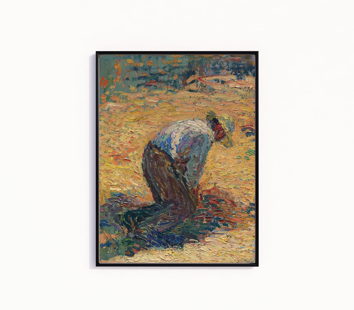 Framed art print of Étude pour La Moisson (Crouching Harvester) by Henri Martin, in a slim black frame on a plain white wall