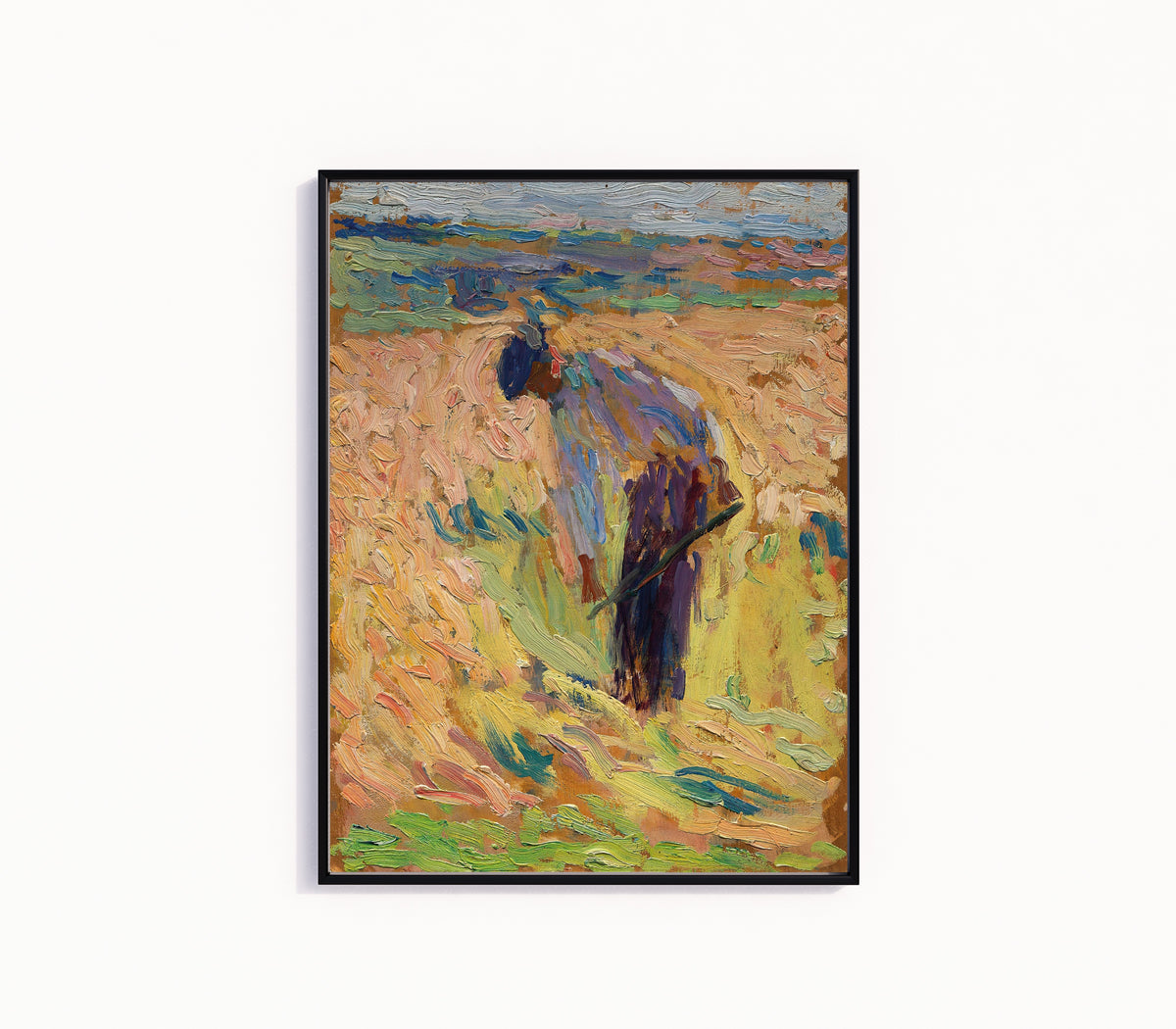 Framed art print of Étude pour La Moisson (Standing Harvester) by Henri Martin, in a slim black frame on a plain white wall