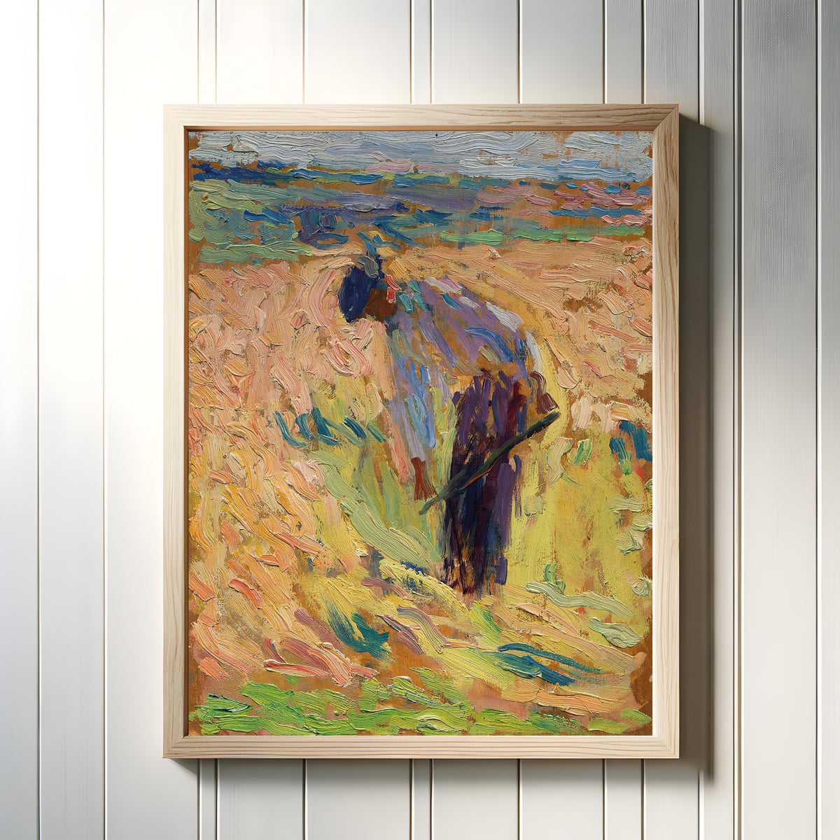 Framed art print of Étude pour La Moisson (Standing Harvester) by Henri Martin, in a light wood frame on a white panelled wall