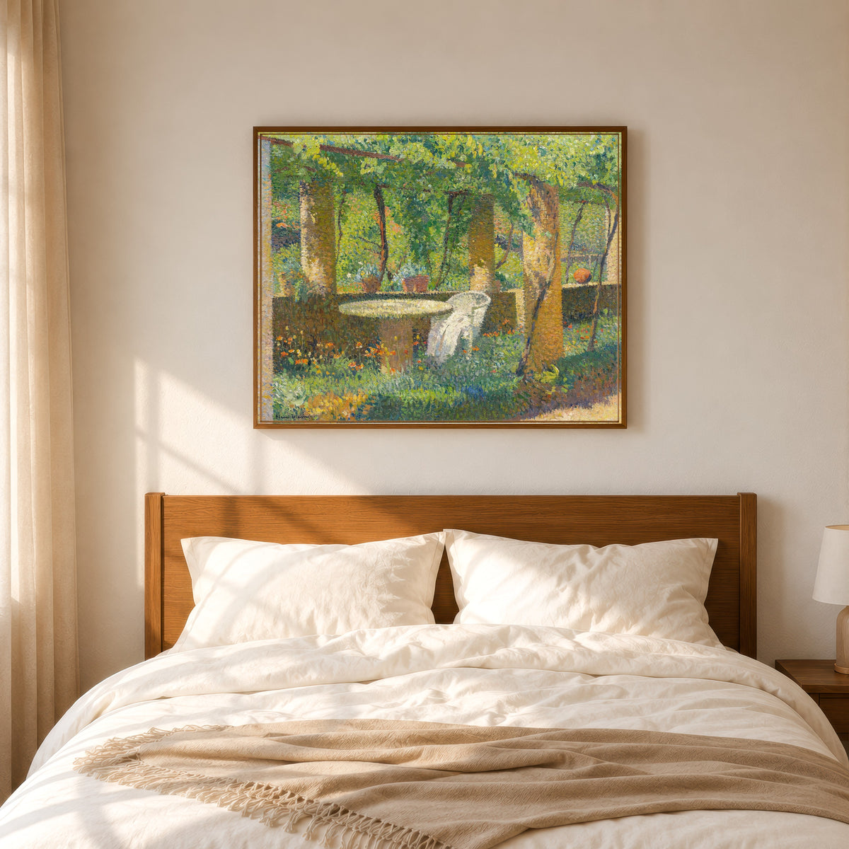 Framed art print of La Tonnelle de Marquayrol by Henri Martin, in a slim wood frame above a bed in a sunlit bedroom
