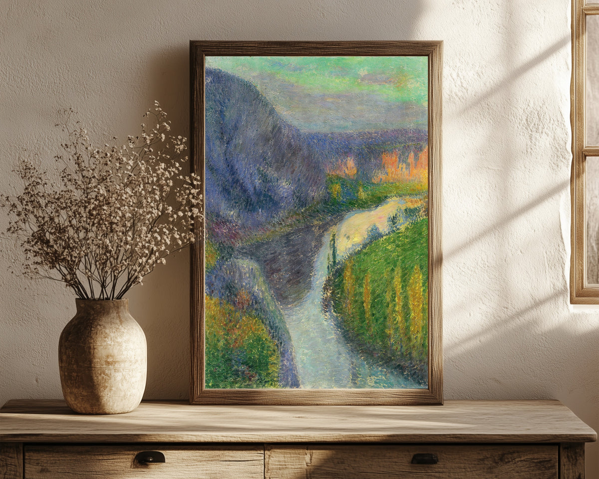 Framed art print of La vallée du Lot, près de Saint-Cirq Lapopie by Henri Martin, in a dark wood frame leaning on a rustic console beside dried flowers