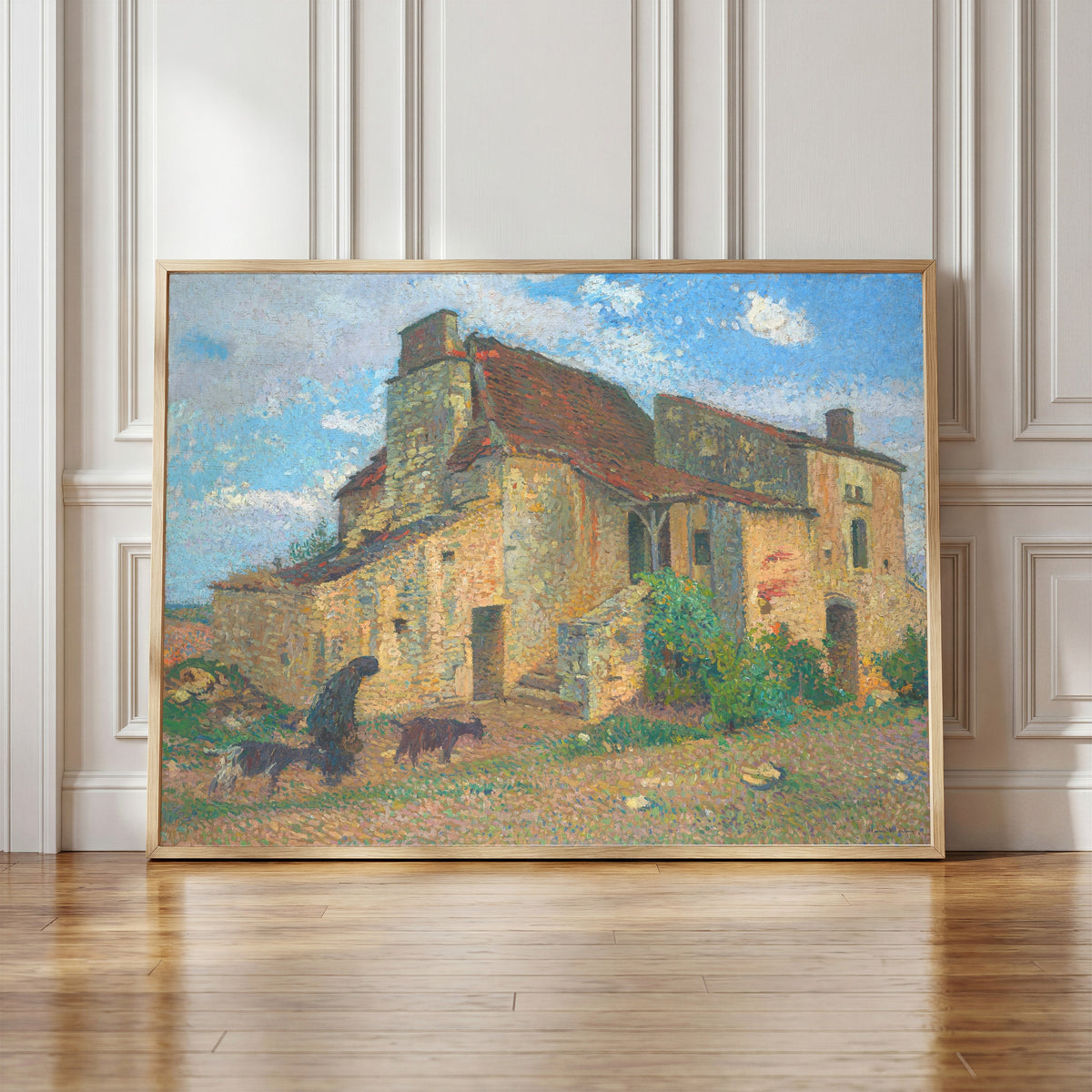 Framed art print of Paysage de campagne by Henri Martin, in a light wood frame leaning against a panelled white wall
