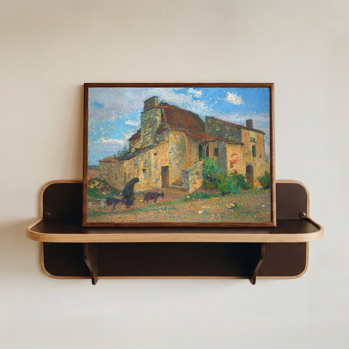 Framed art print of Paysage de campagne by Henri Martin, in a dark wood frame resting on a wall shelf