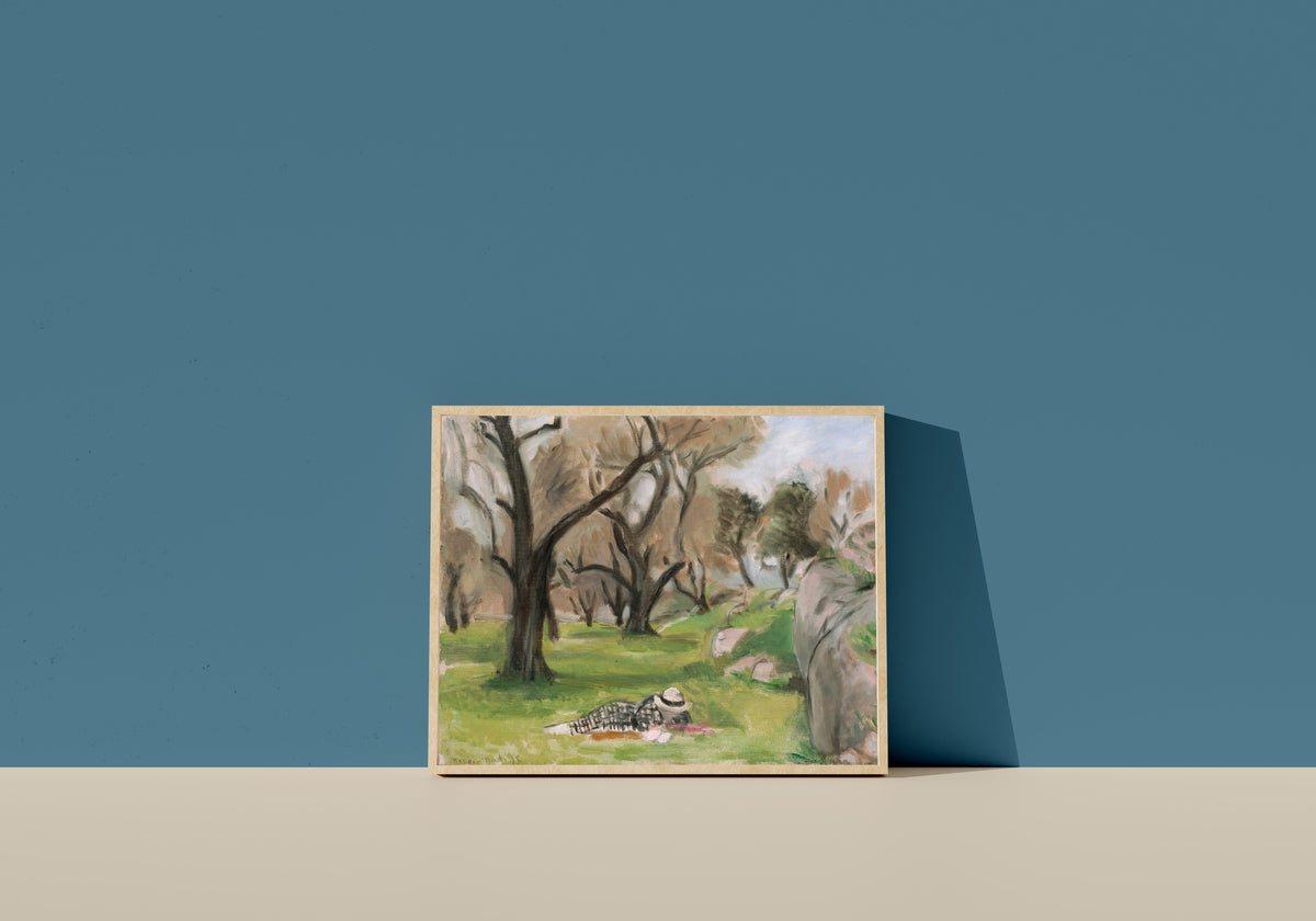 Framed art print of Landscape of the Midi by Henri Matisse, in a light wood frame leaning on a blue wall