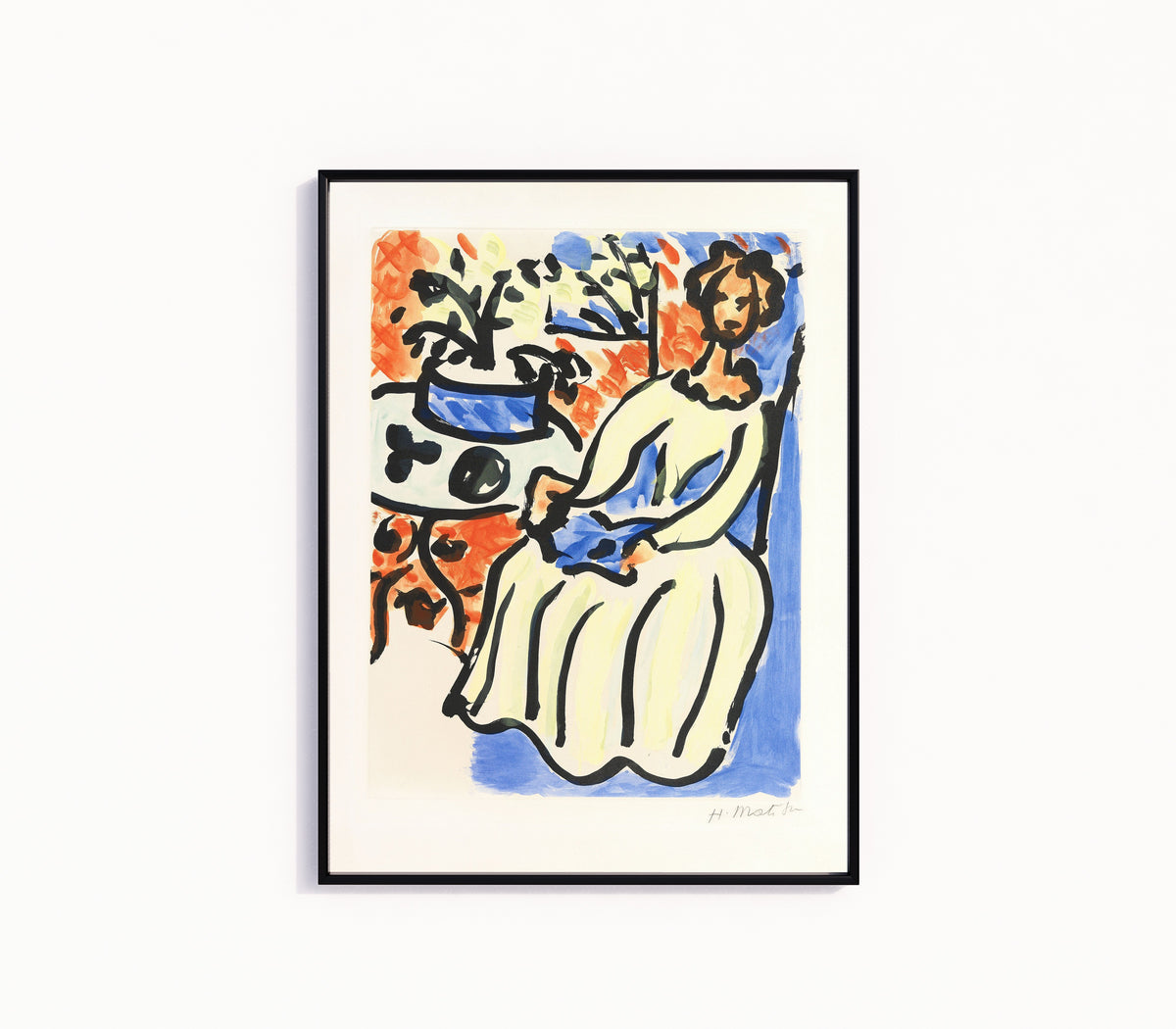 Framed art print of Marie-José in a Yellow Dress by Henri Matisse, in a slim black frame on a plain white wall