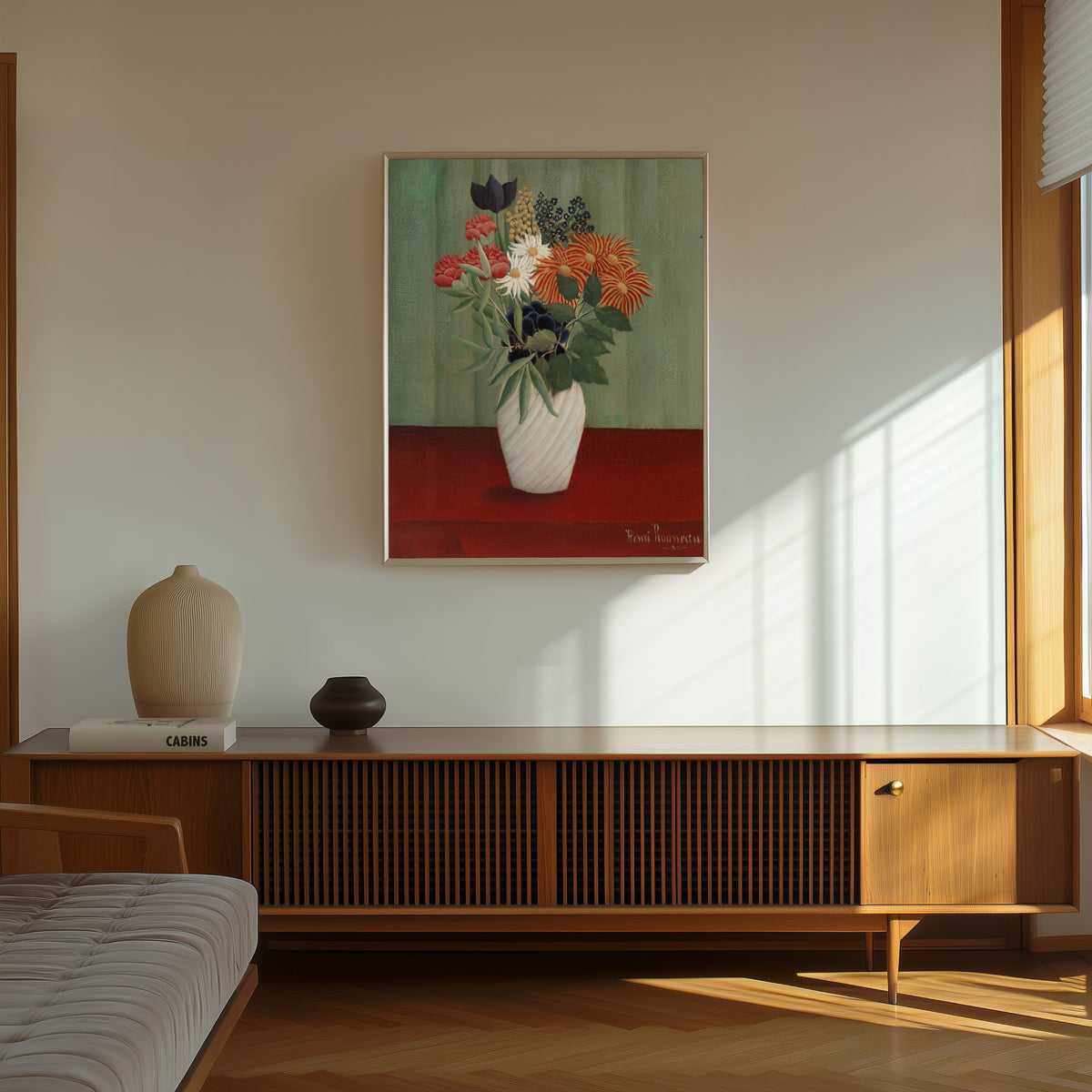Framed art print of Bouquet of Flowers with China Asters and Tokyos by Henri Rousseau, in a thin light frame on a sunlit wall above a wooden sideboard