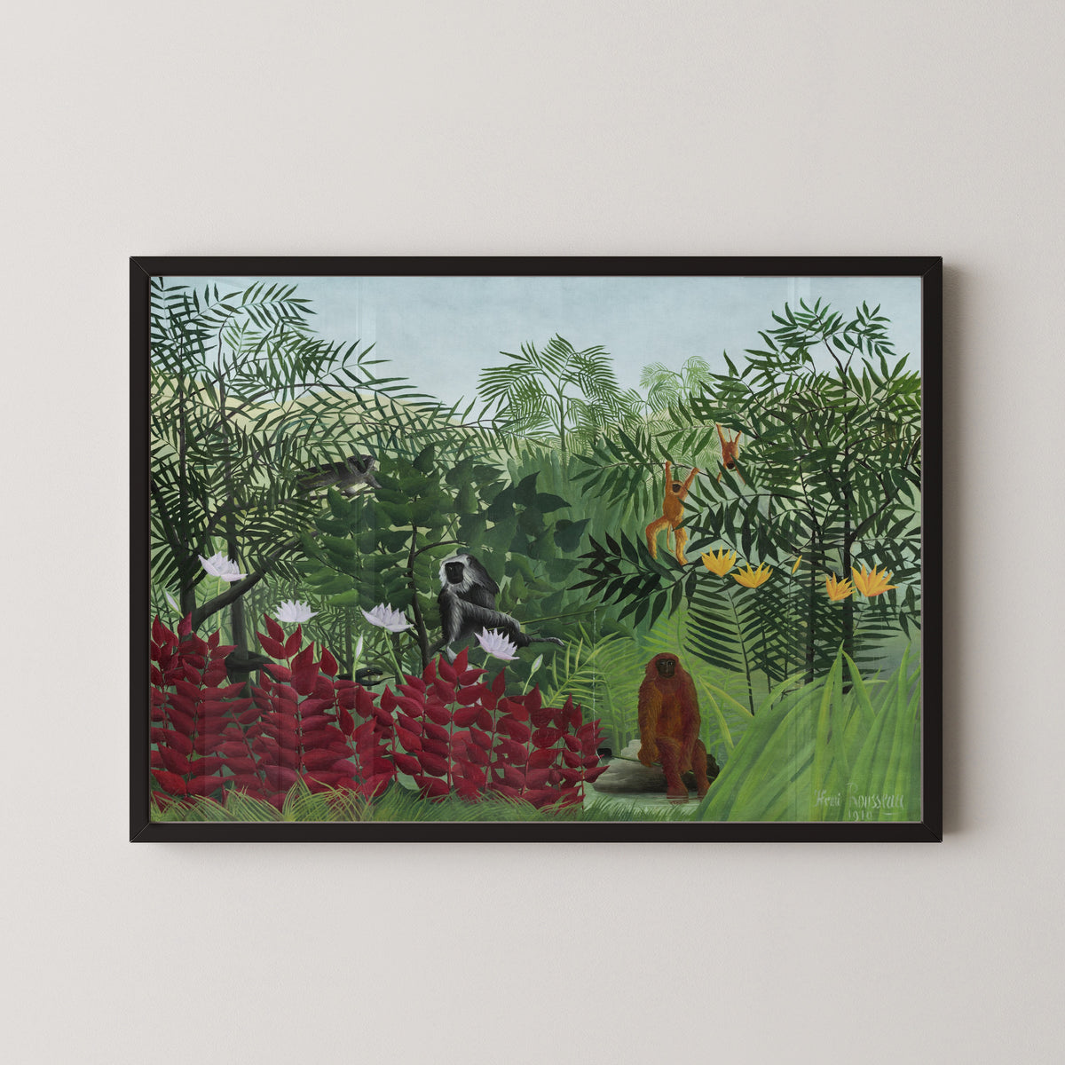 Tropical Forest with Monkeys by Henri Rousseau — in a black frame on a pale wall