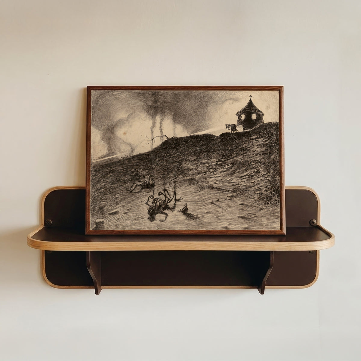Framed art print of Martian Viewing the Carnage by Henrique Alvim Corrêa, in a dark wood frame resting on a wall shelf