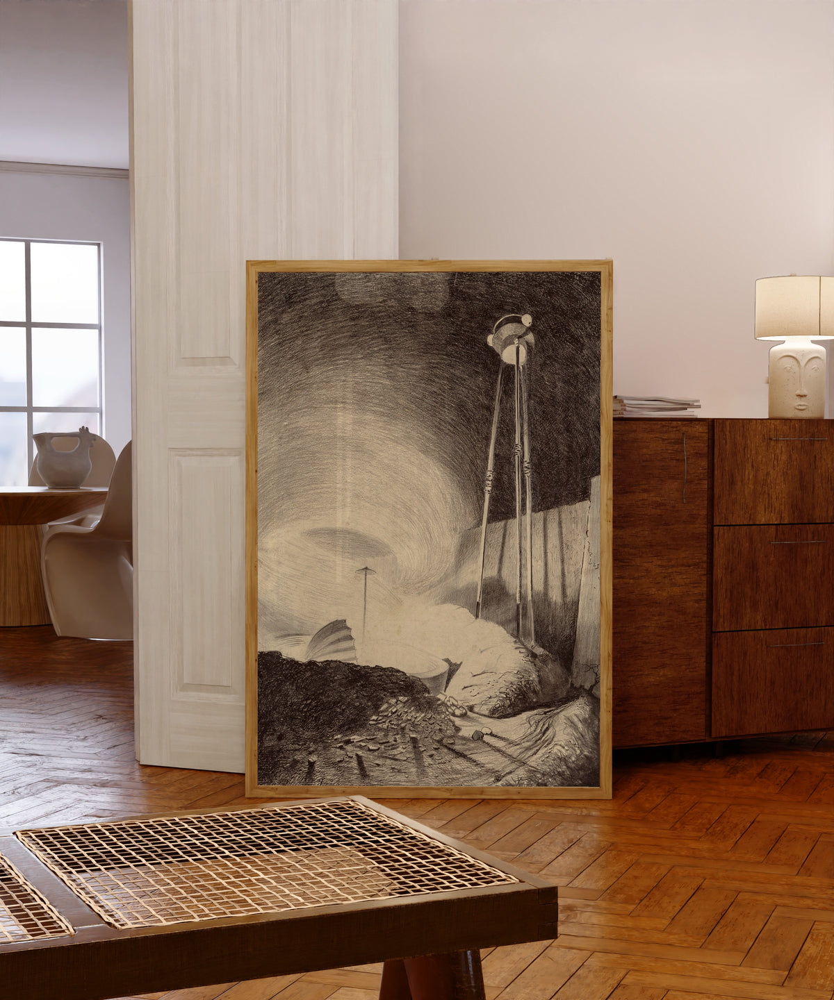 Framed art print of Martian Viewing the Vapour by Henrique Alvim Corrêa, in a light wood frame leaning in a warm room with a parquet floor