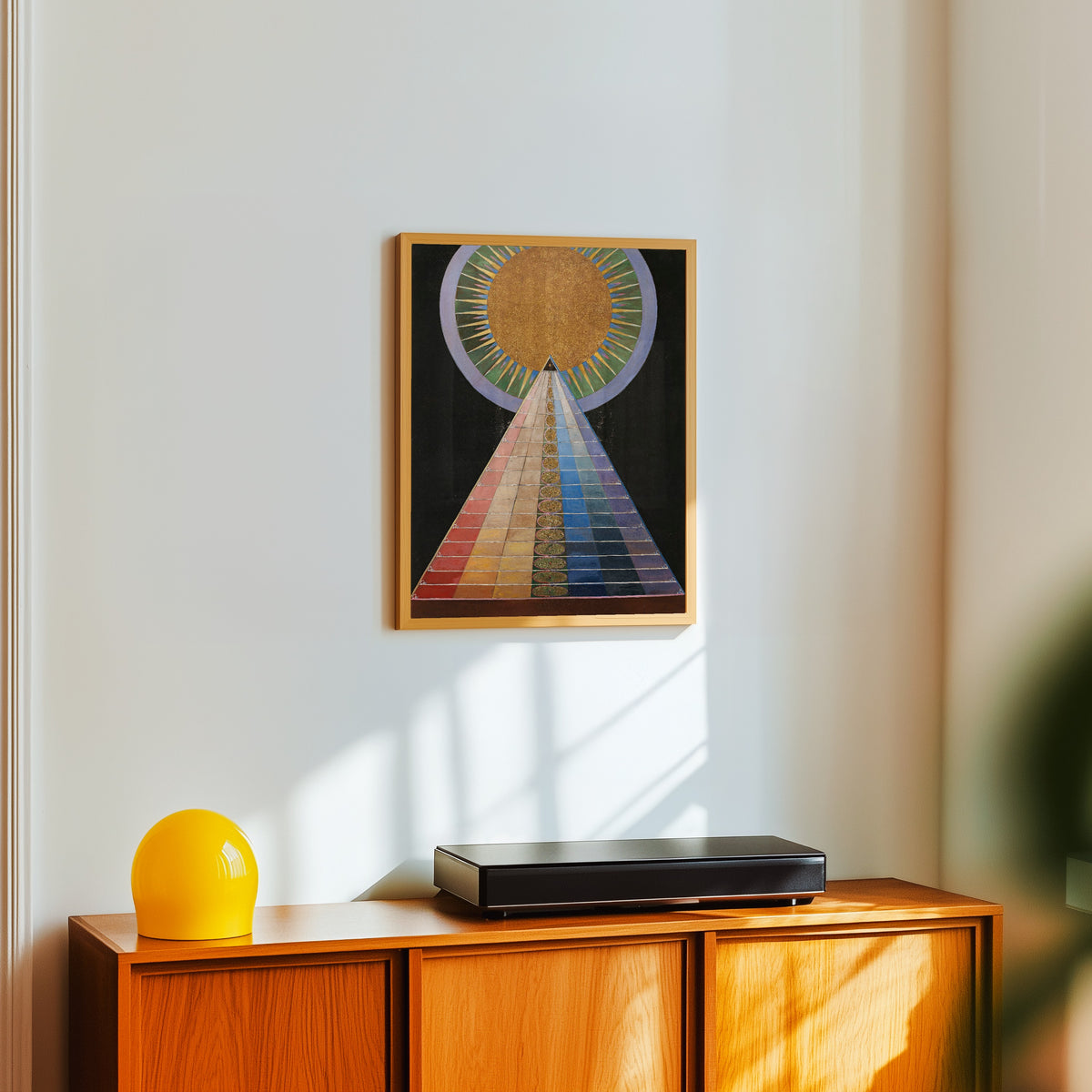 Framed art print of Altarpiece No. 1, Group X by Hilma af Klint, in a light wood frame on a white wall above an orange sideboard