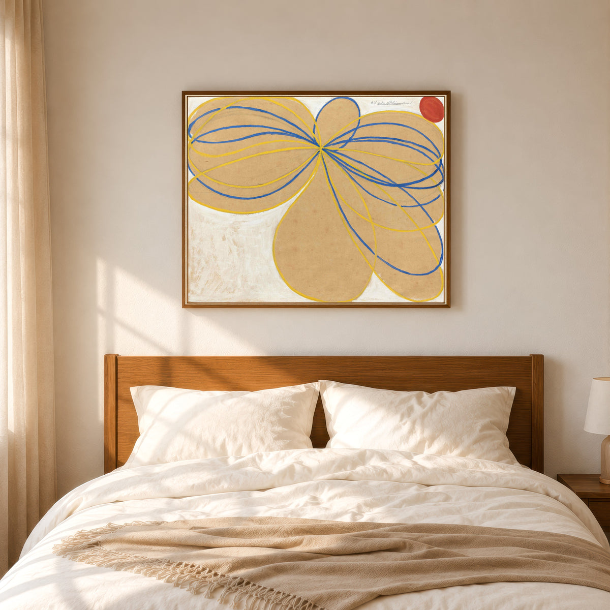 Framed art print of The Seven-Pointed Star No. 1 by Hilma af Klint, in a slim wood frame above a bed in a sunlit bedroom