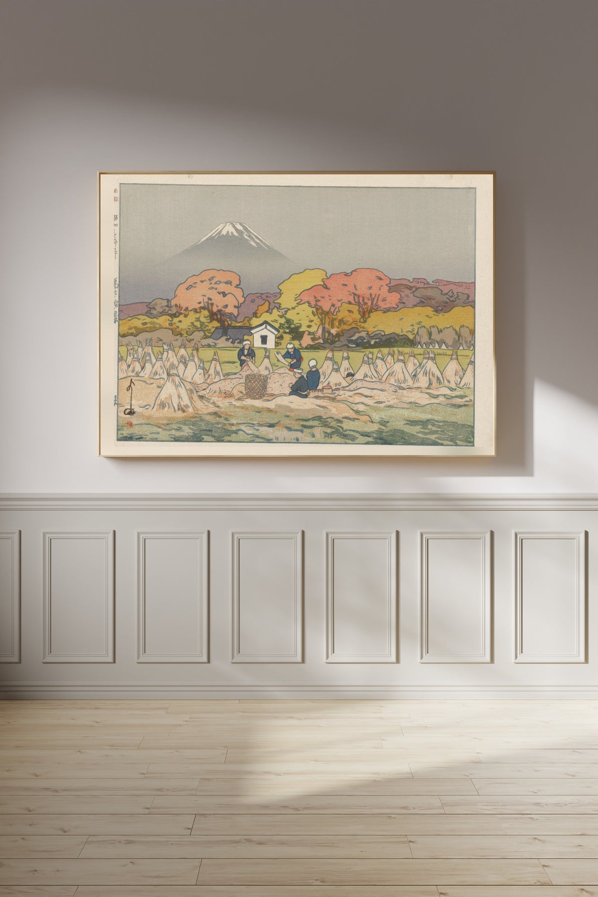 Framed art print of Autumn by Hiroshi Yoshida, on a panelled wall in afternoon light
