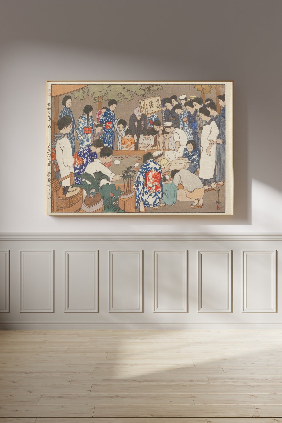 Framed art print of Dipping for Goldfish by Hiroshi Yoshida, on a panelled wall in afternoon light