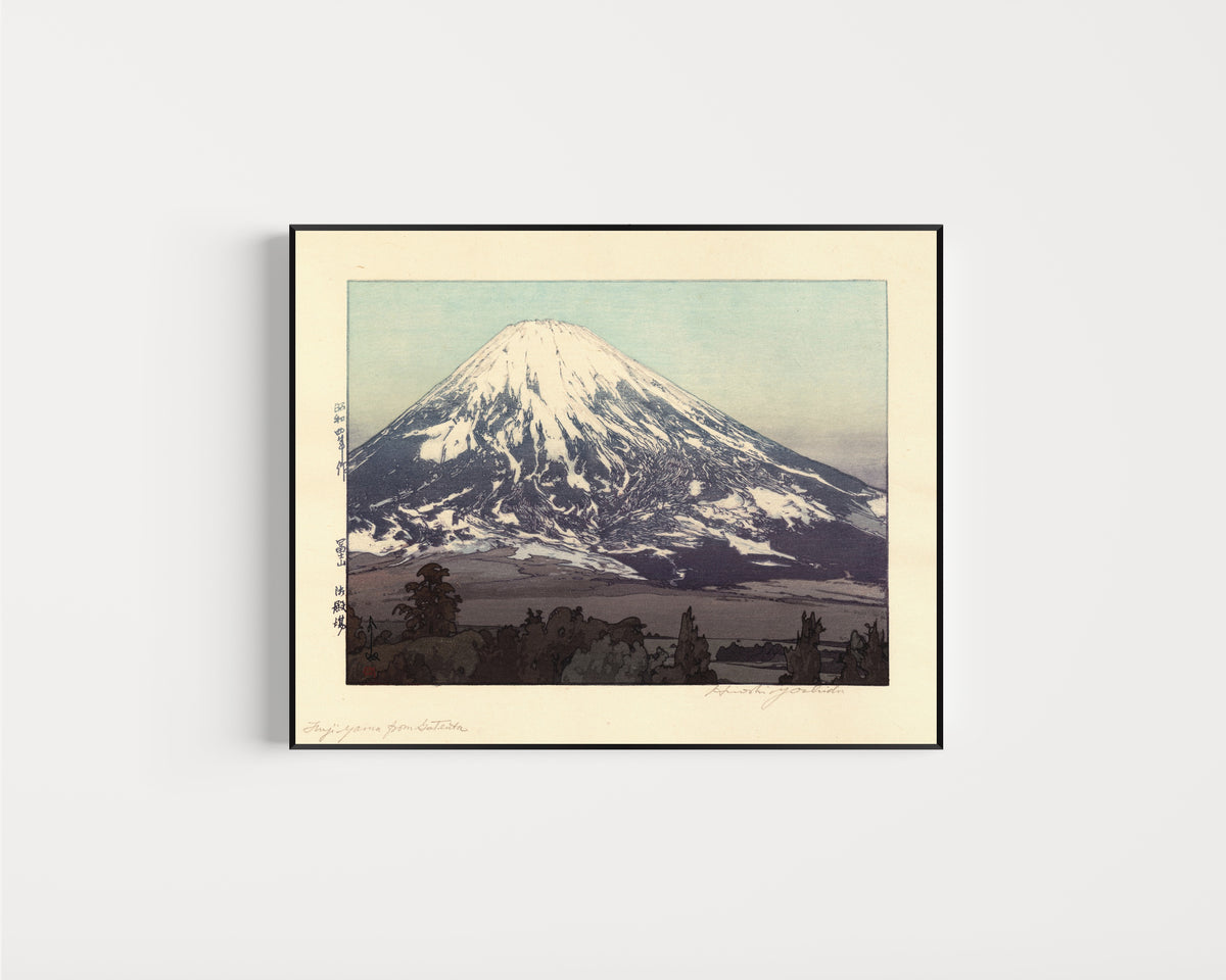 Framed art print of Fujiyama from Gotemba by Hiroshi Yoshida, in a slim black frame on a plain white wall