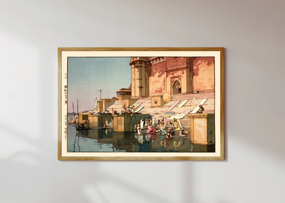 Framed art print of Ghat in Benares, India by Hiroshi Yoshida, in a light wood frame on a sunlit white wall