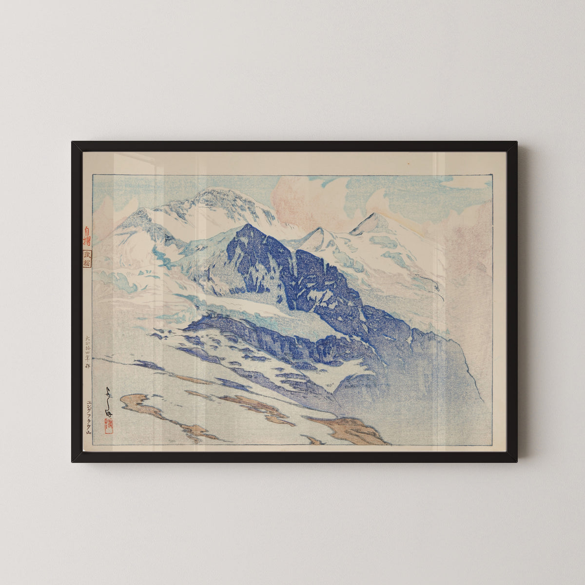 Framed art print of Jungfrau by Hiroshi Yoshida, in a black frame on a pale wall