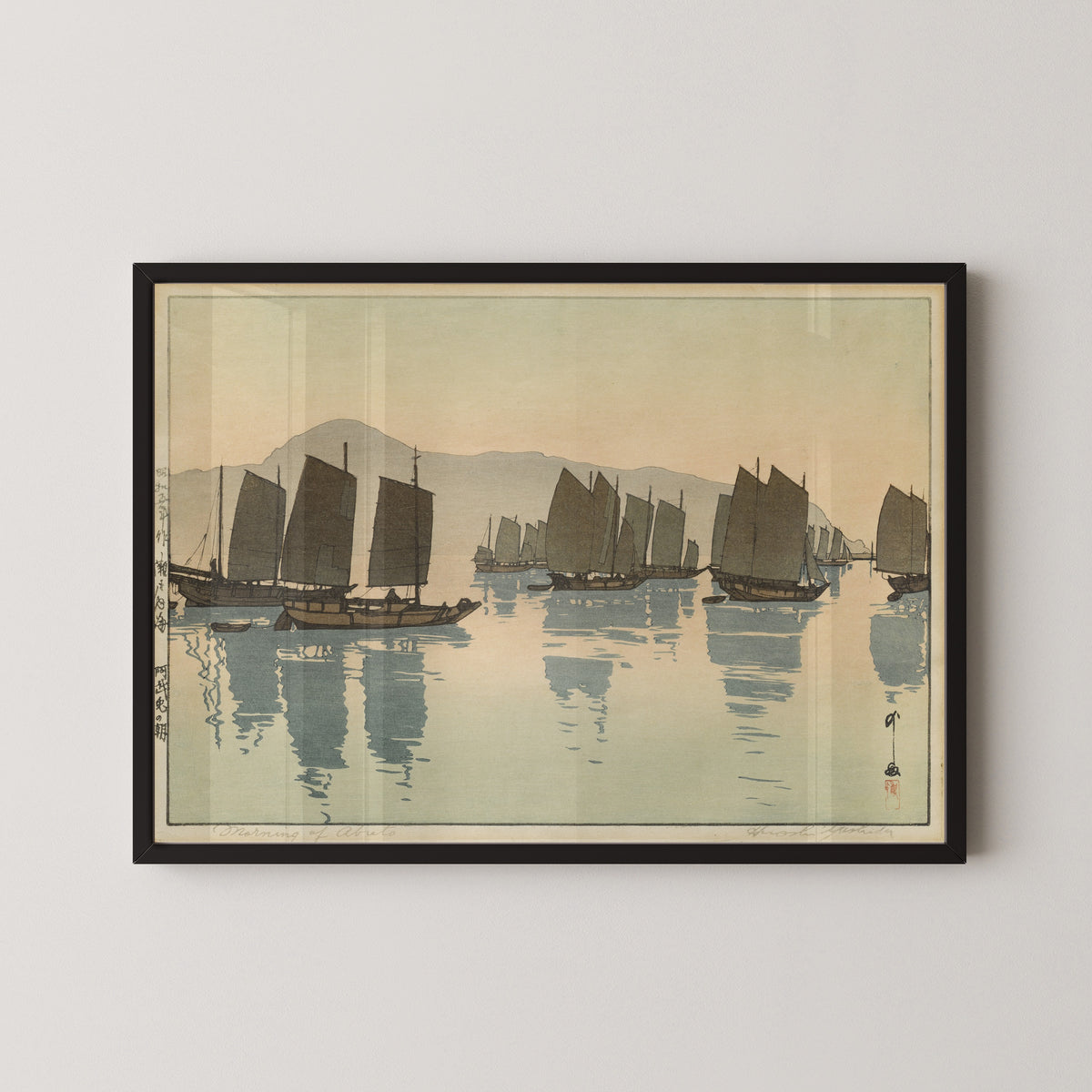 Framed art print of Morning of Abuto from Inland Sea, Second Series by Hiroshi Yoshida, in a black frame on a pale wall