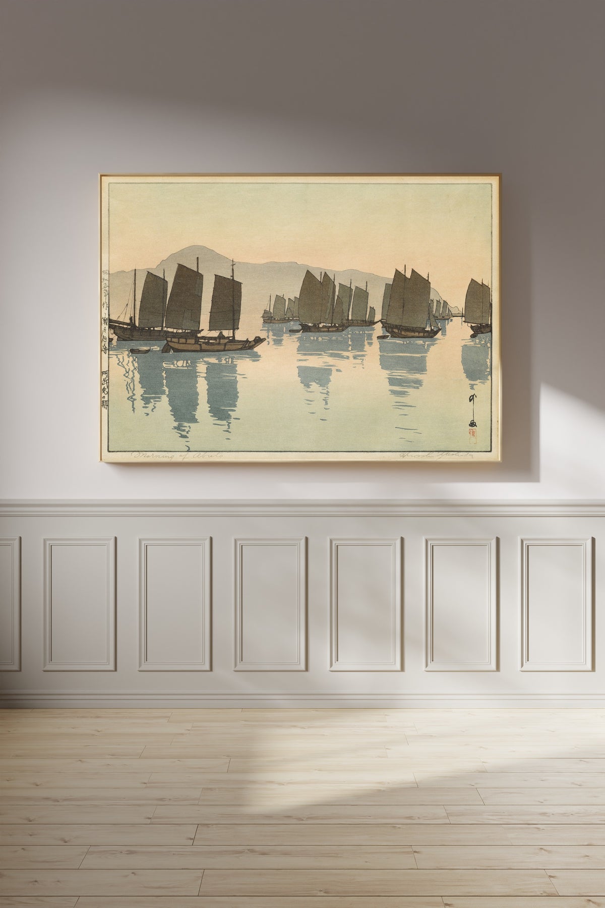 Framed art print of Morning of Abuto from Inland Sea, Second Series by Hiroshi Yoshida, on a panelled wall in afternoon light