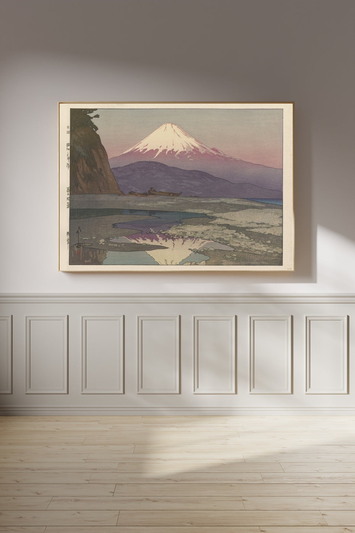 Framed art print of Okitsu by Hiroshi Yoshida, on a panelled wall in afternoon light