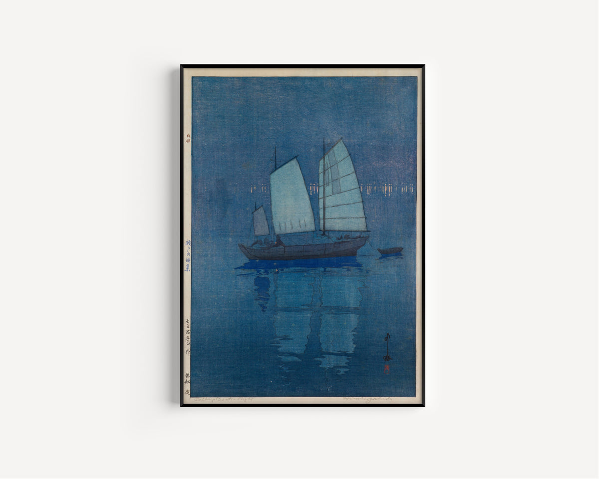 Framed art print of Sailing Boats, Night by Hiroshi Yoshida, in a slim black frame on a plain white wall