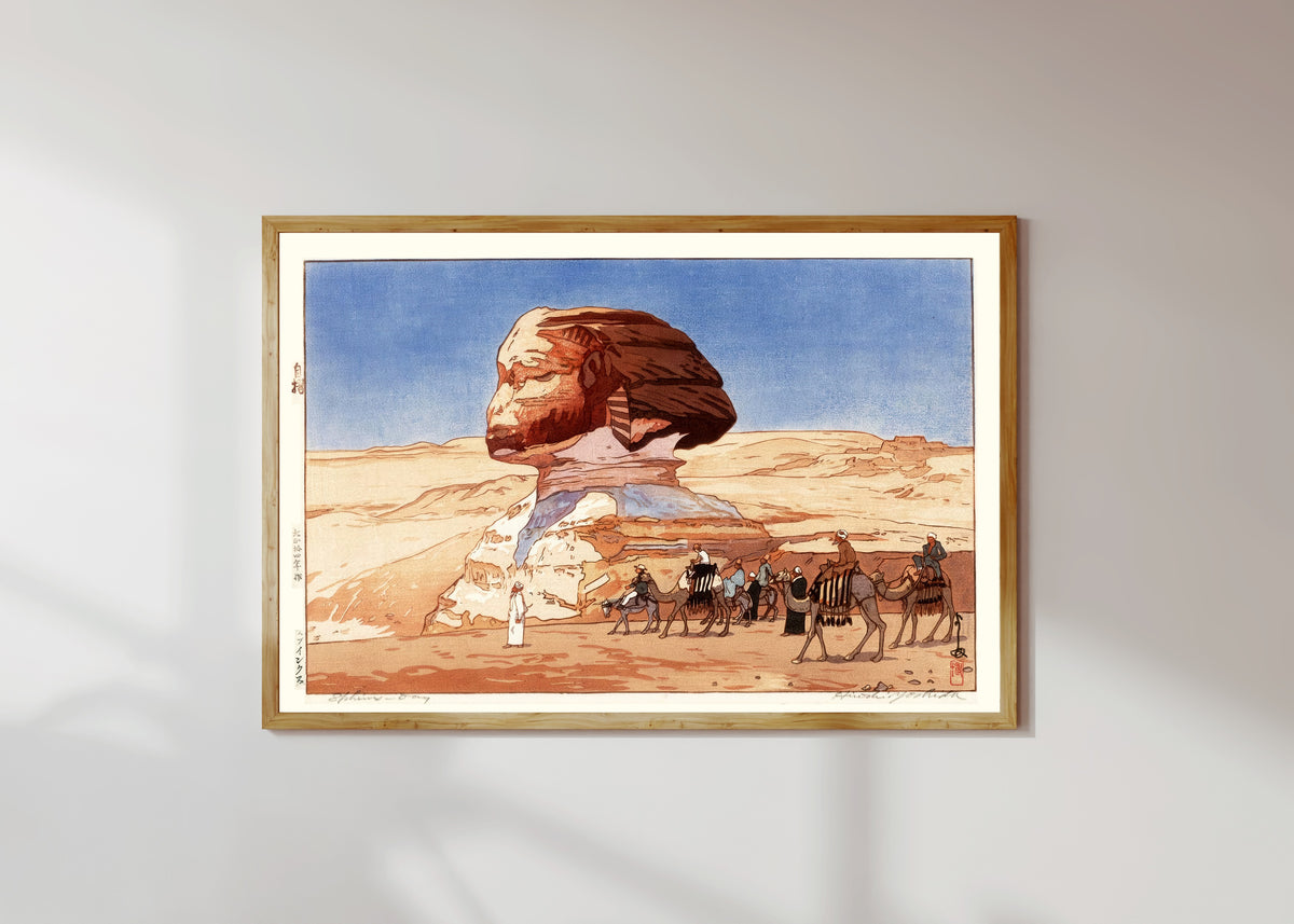 Framed art print of Sphinx at Day by Hiroshi Yoshida, in a light wood frame on a sunlit white wall