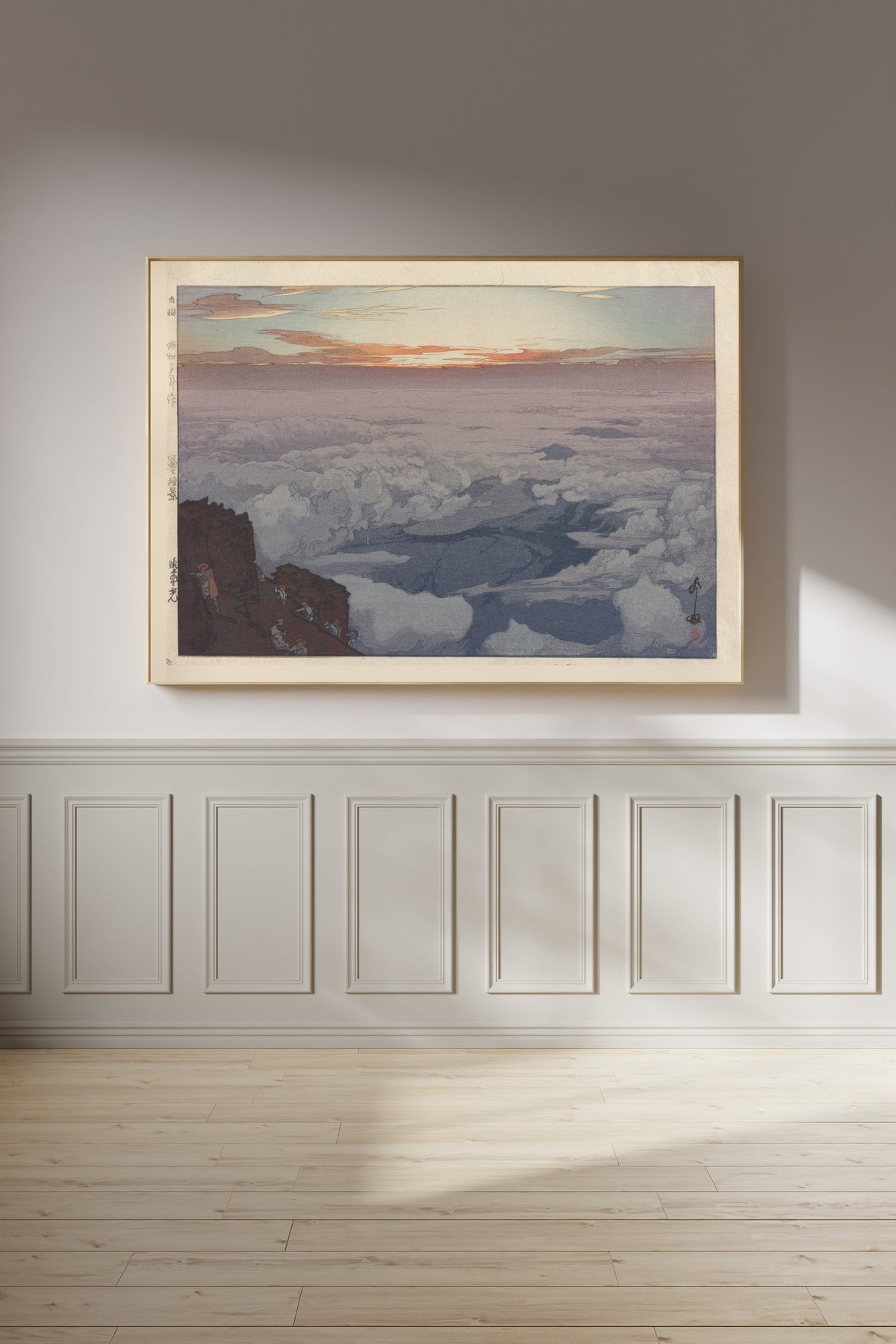 Framed art print of Sunrise Rite by Hiroshi Yoshida, on a panelled wall in afternoon light