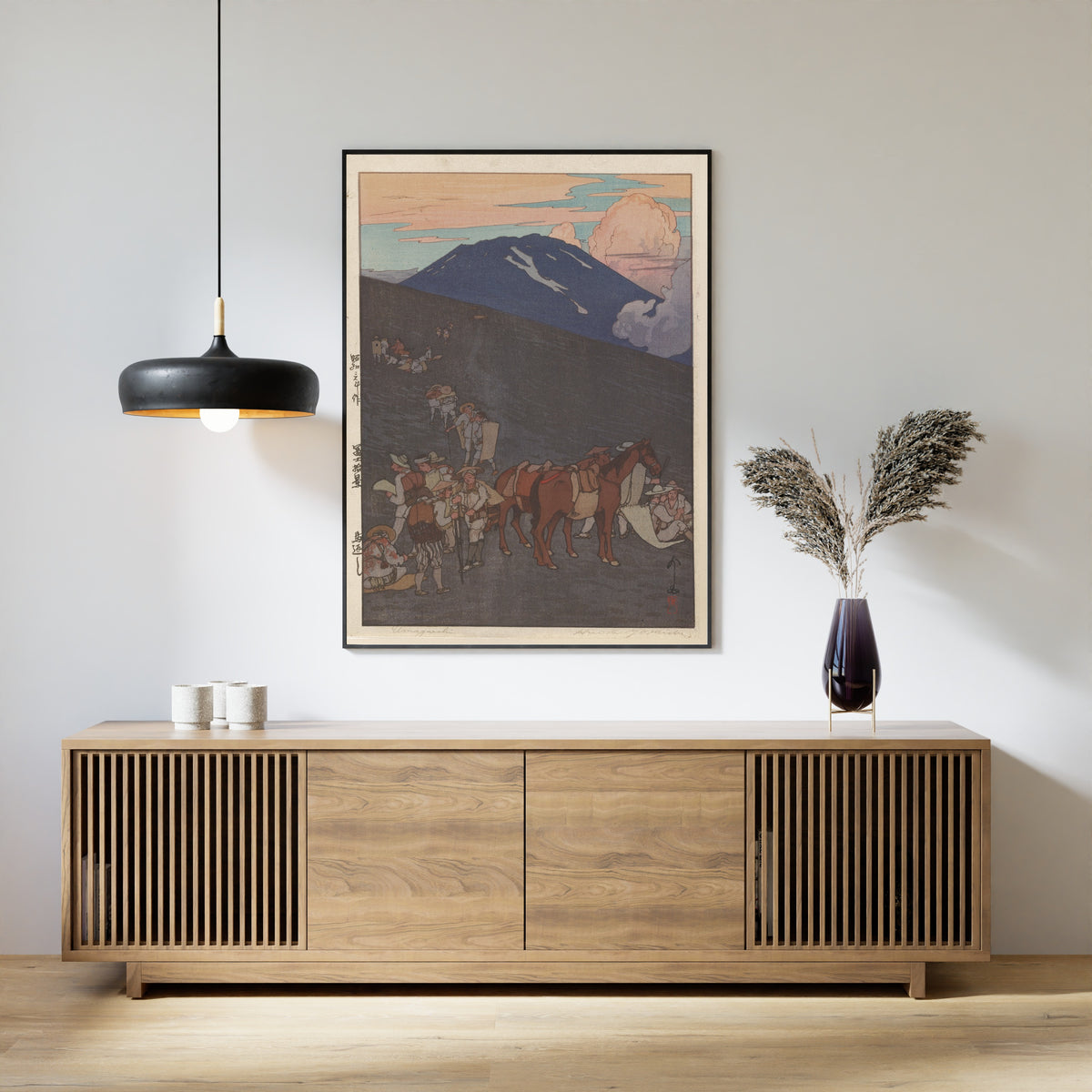 Framed art print of The Horse Turn-Back by Hiroshi Yoshida, above a slatted wood sideboard