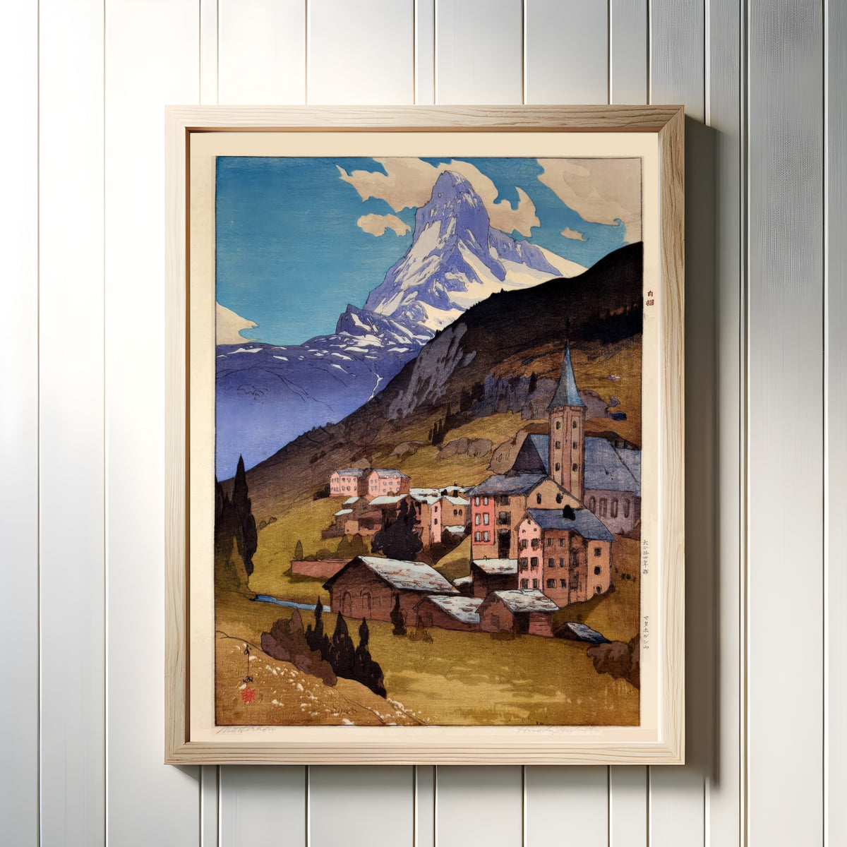 Framed art print of The Matterhorn, Switzerland by Hiroshi Yoshida, in a light wood frame on a white panelled wall