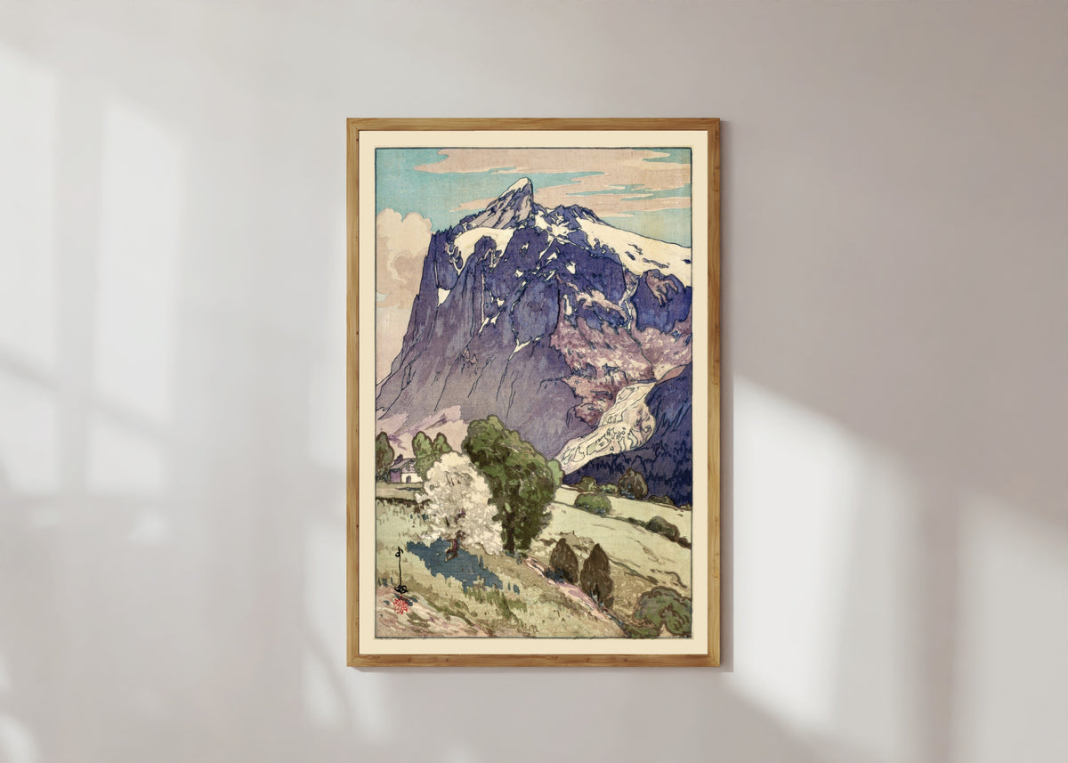 Framed art print of The Wetterhorn, Switzerland by Hiroshi Yoshida, in a light wood frame on a sunlit white wall