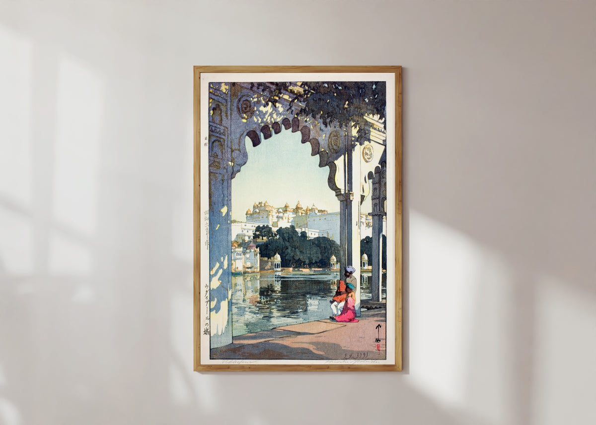 Framed art print of Udaipur Castle, India by Hiroshi Yoshida, in a light wood frame on a sunlit white wall