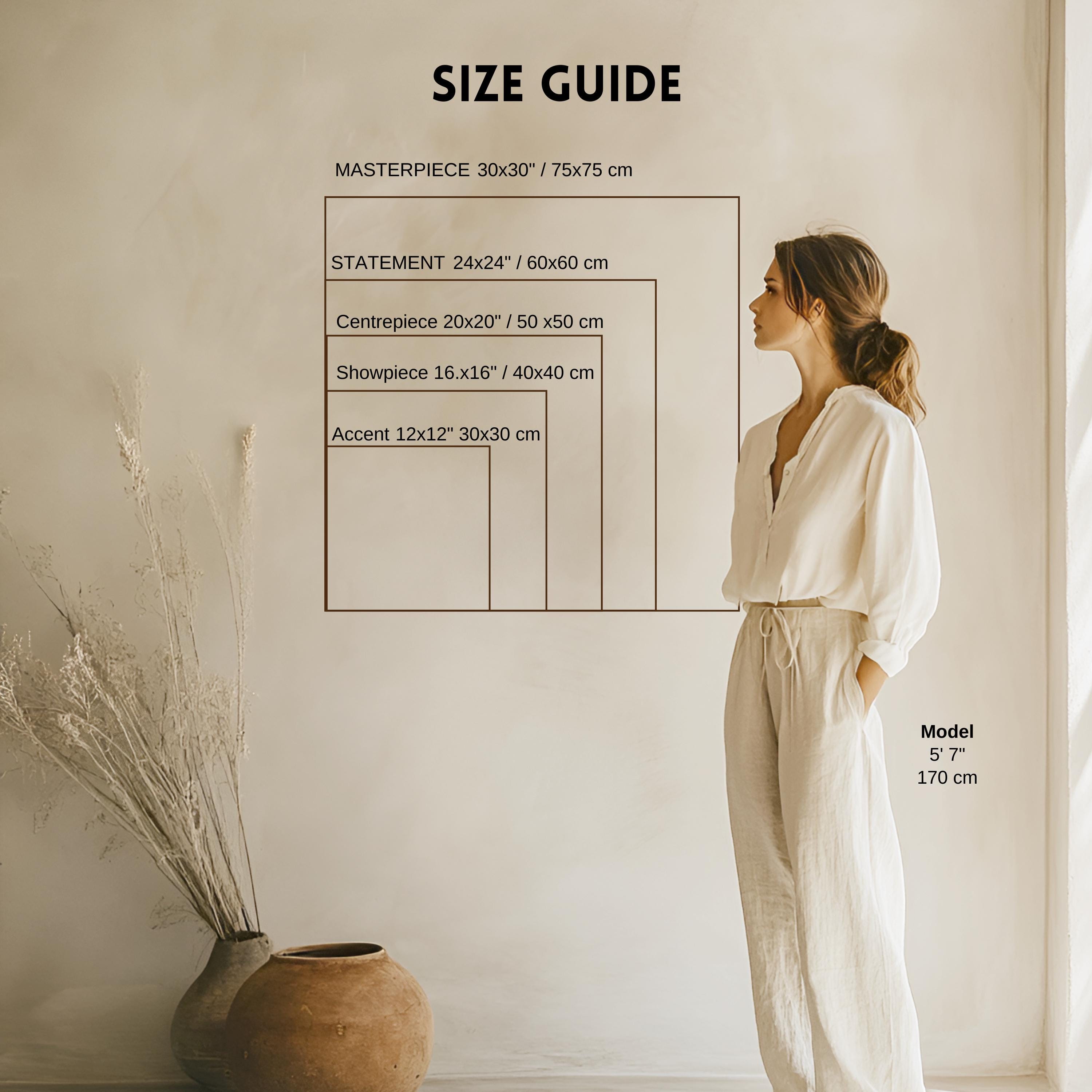 a woman standing in front of a wall with a size guide displayed, which provides measurements for different sizes of a Masterpiece.