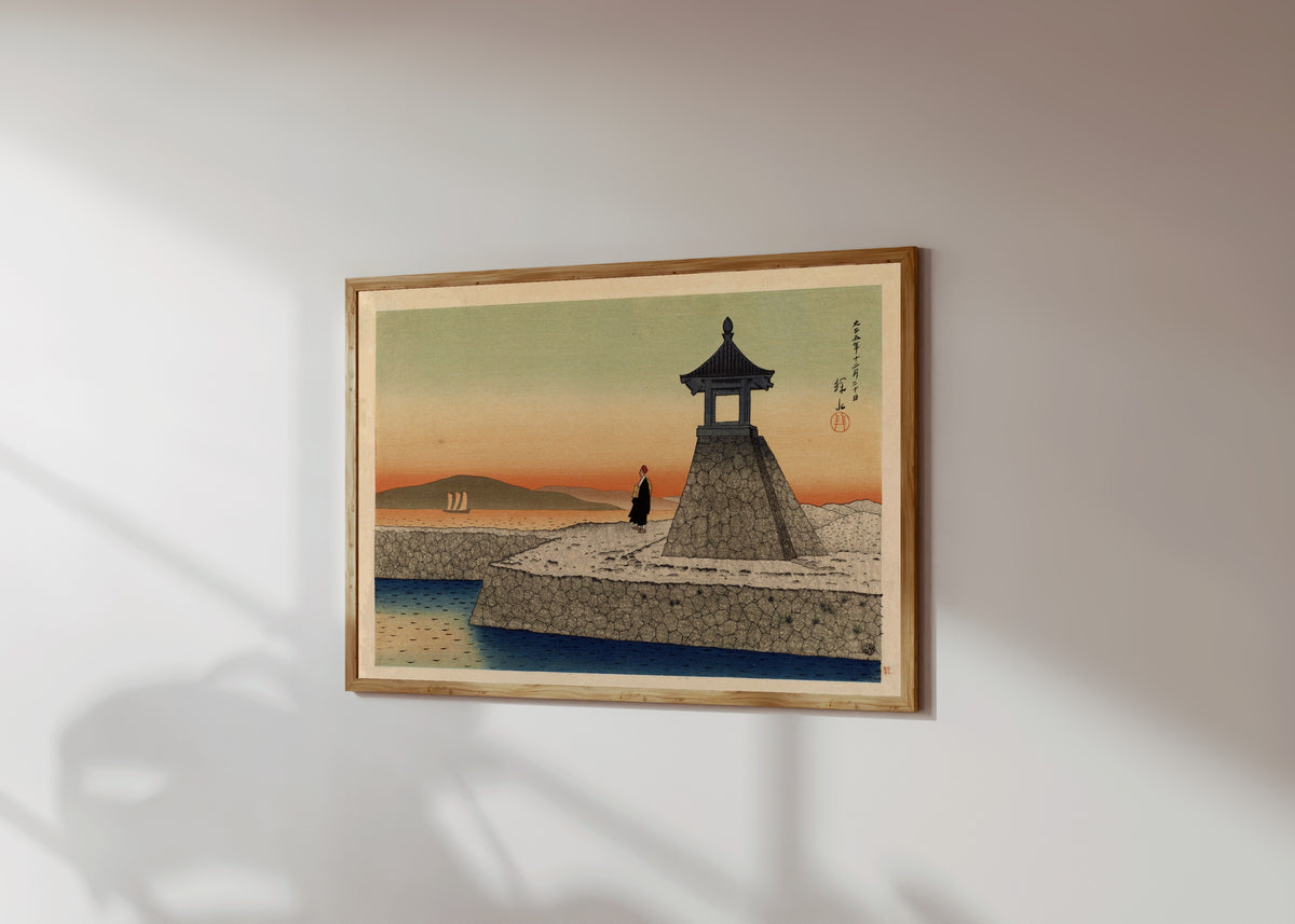 Framed art print of Sunrise at Akashi by Ito Shinsui, in a light wood frame on a sunlit white wall, seen at a slight angle