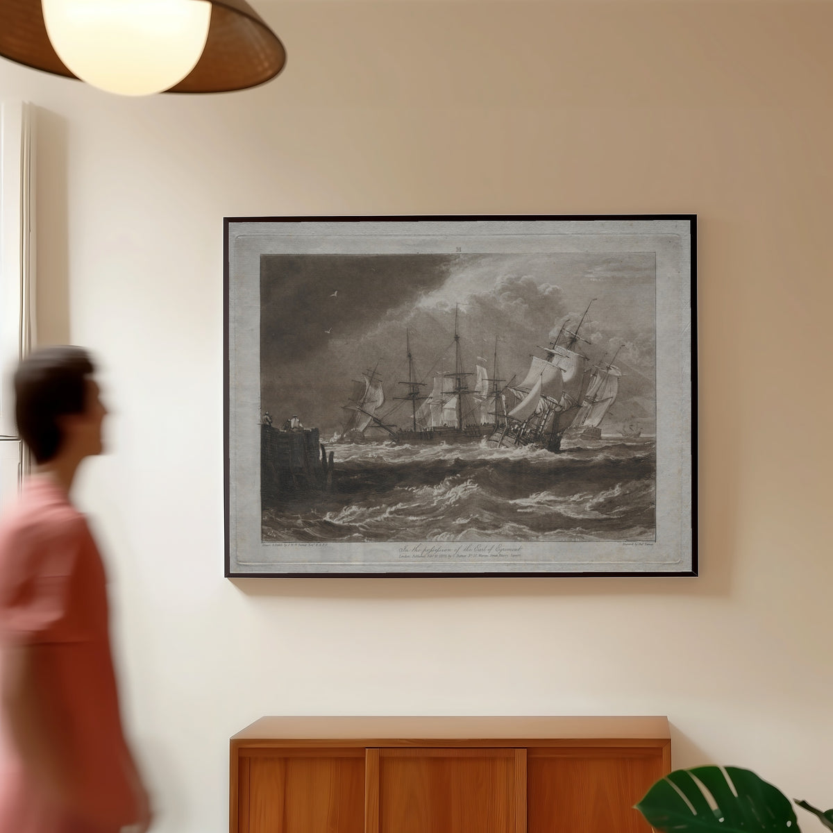 Framed art print of Liber Studiorum: Ships in a Breeze by J.M.W. Turner, in a slim black frame on a warm wall in a sunlit room