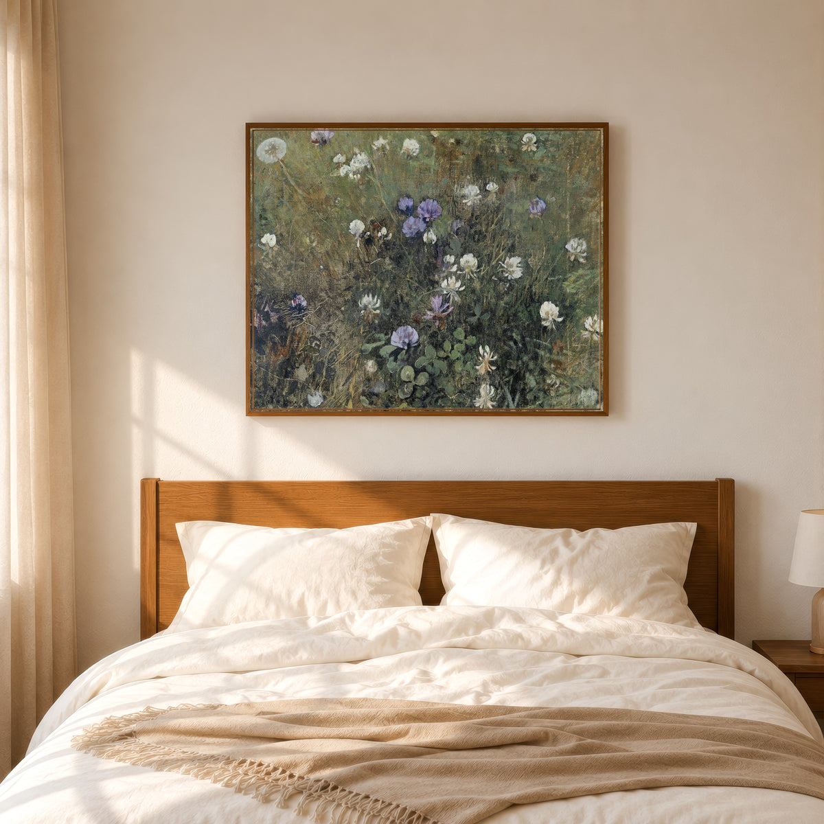 Framed art print of Blooming Clover by Jac van Looij, in a slim wood frame above a bed in a sunlit bedroom