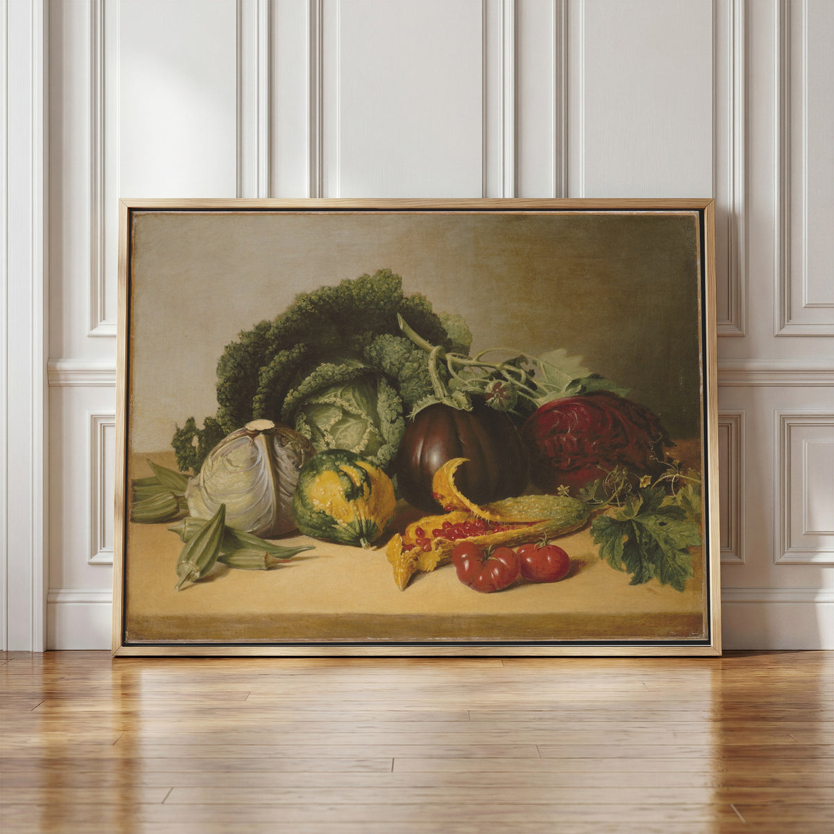 Framed art print of Still Life: Balsam Apple and Vegetables by James Peale, in a light wood frame leaning against a panelled white wall