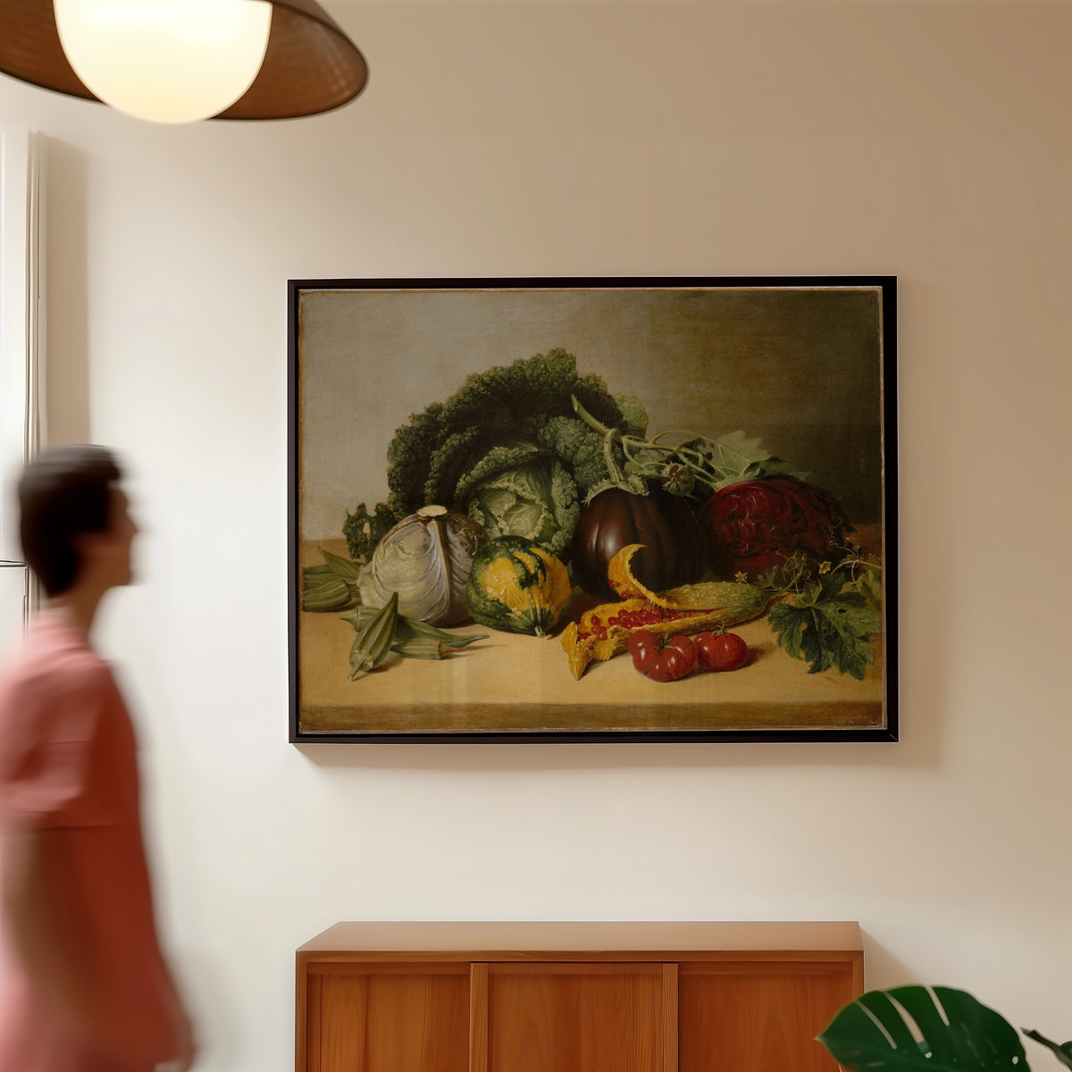 Framed art print of Still Life: Balsam Apple and Vegetables by James Peale, in a slim black frame on a warm wall in a sunlit room