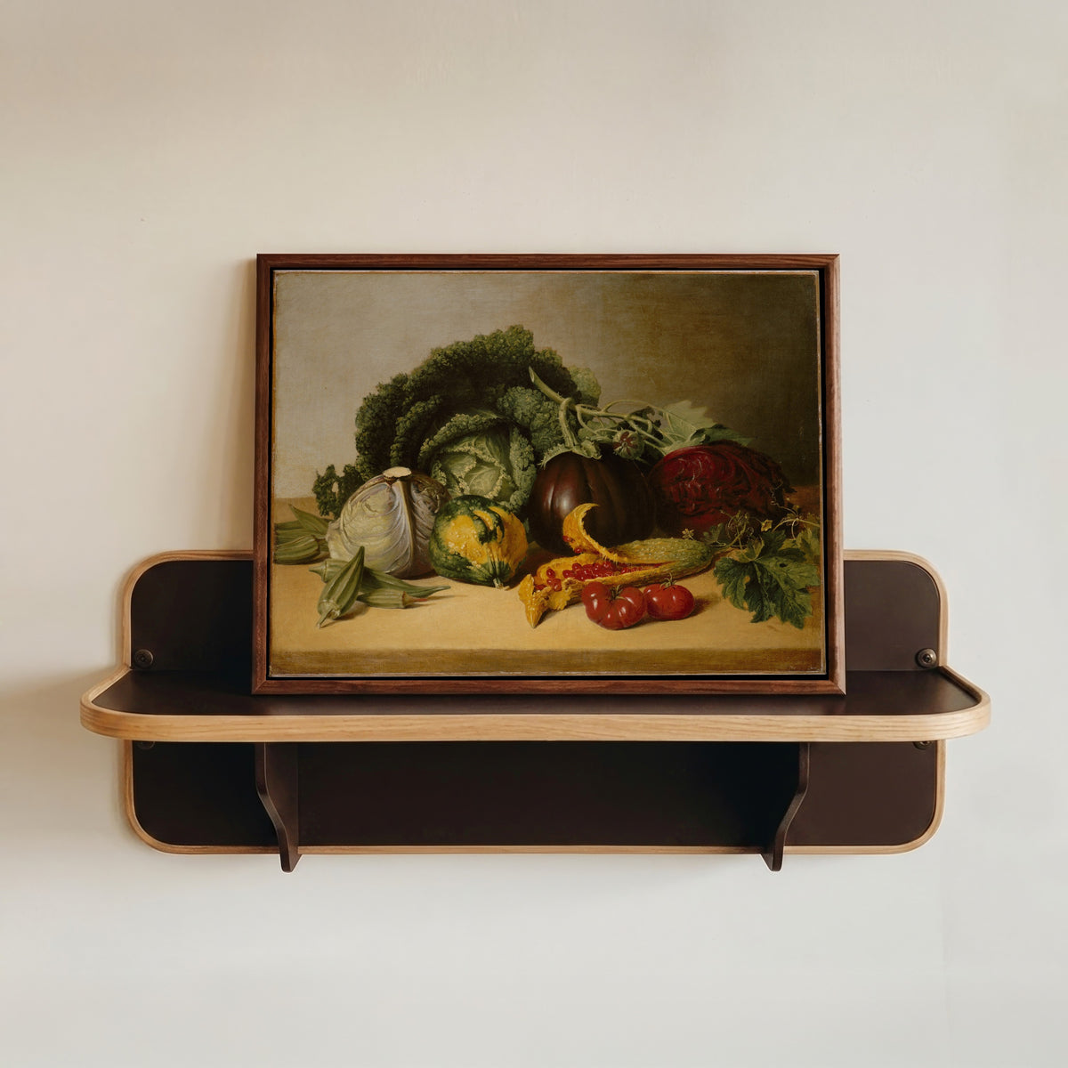 Framed art print of Still Life: Balsam Apple and Vegetables by James Peale, in a dark wood frame resting on a wall shelf