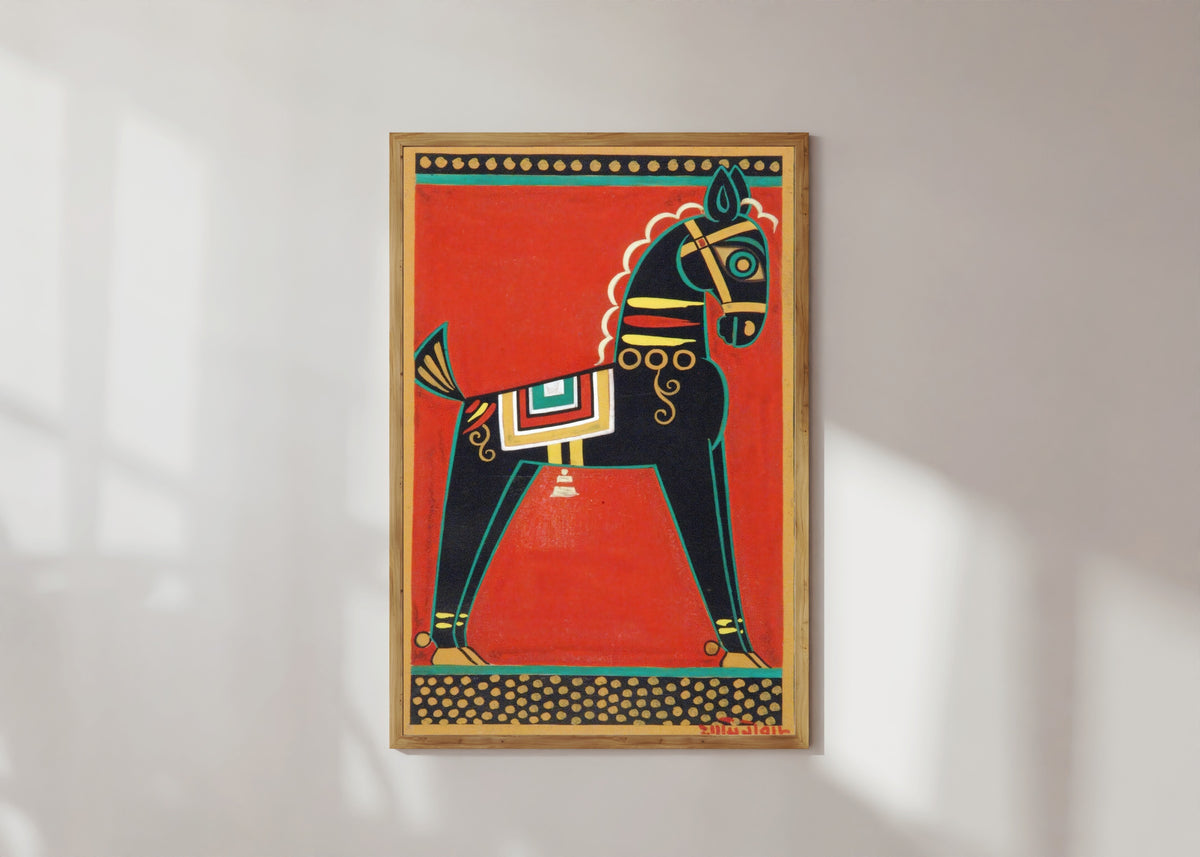 Framed art print of Black Horse (Kalo Ghora) by Jamini Roy, in a light wood frame on a sunlit white wall