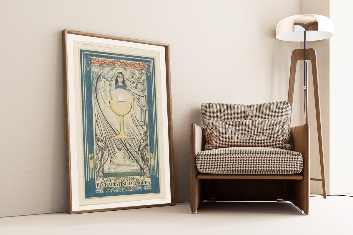 Affiche voor het Internationaal Eucharistisch Congres, 1924 by Jan Toorop — framed and leaning against a wall beside an armchair and a floor lamp