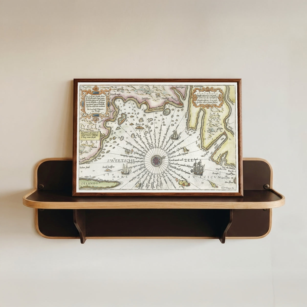 Framed art print of Coast of Sweden between Kalmar and Stockholm by Joannes van Doetechum the Elder, in a dark wood frame resting on a wall shelf