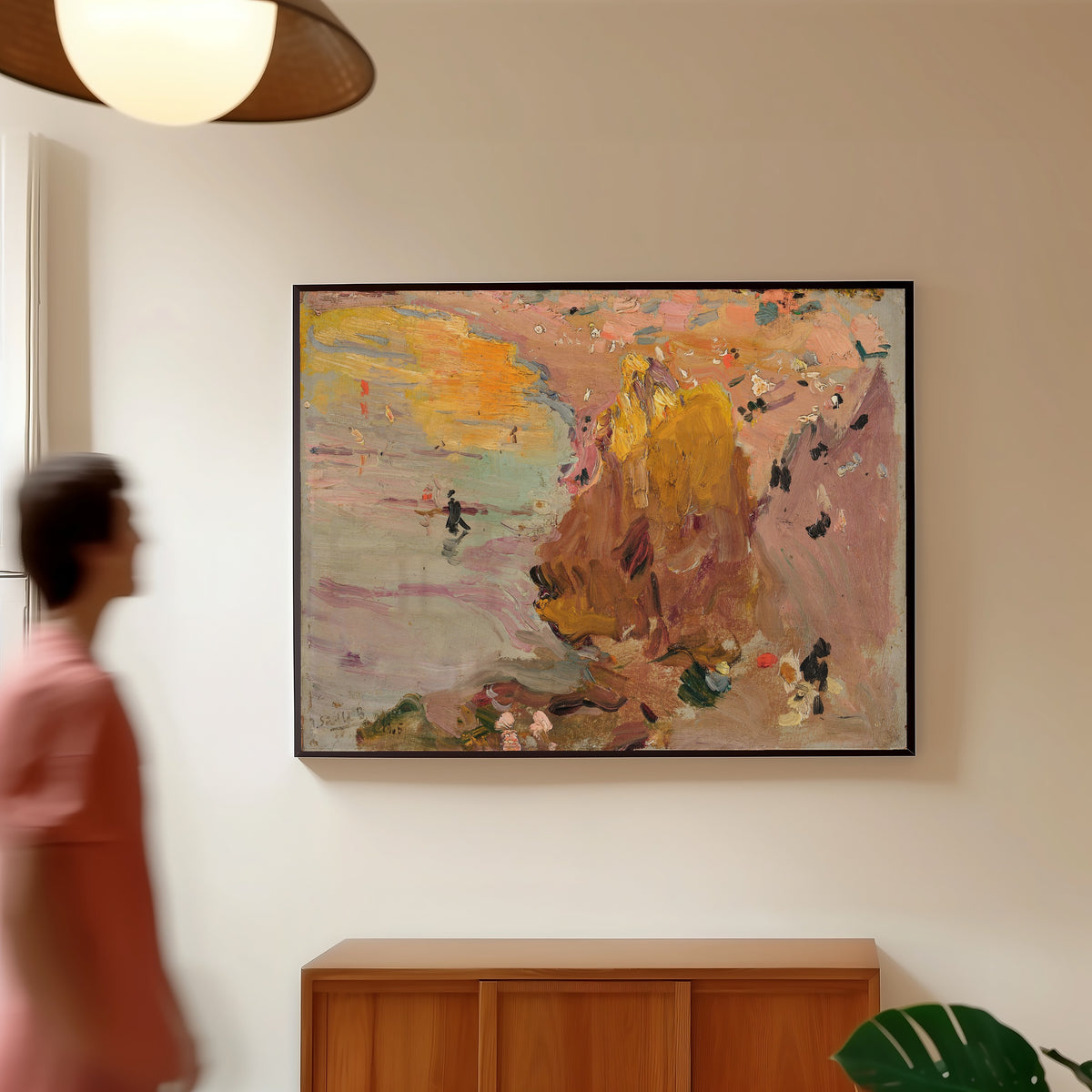 Framed art print of Beach of Biarritz by Joaquín Sorolla, in a slim black frame on a warm wall in a sunlit room