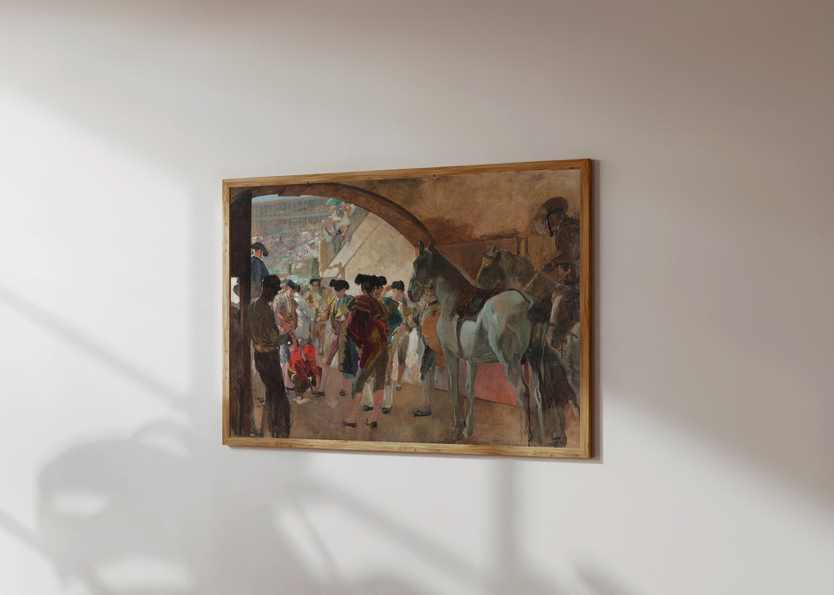 Framed art print of Before the Bullfight (Antes de la corrida) by Joaquín Sorolla, in a light wood frame on a sunlit white wall, seen at a slight angle