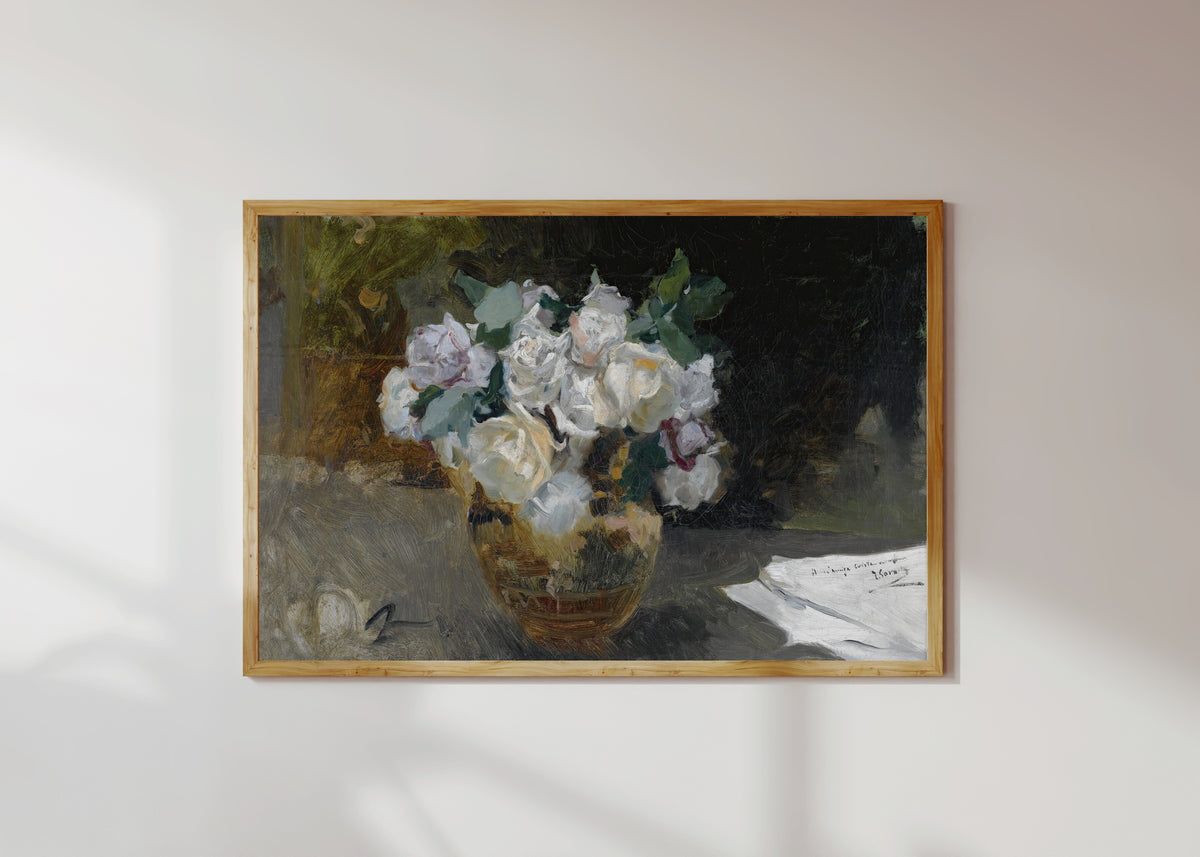 Framed art print of Bouquet of White Roses (Bodegón de rosas blancas) by Joaquín Sorolla, in a light wood frame on a sunlit white wall