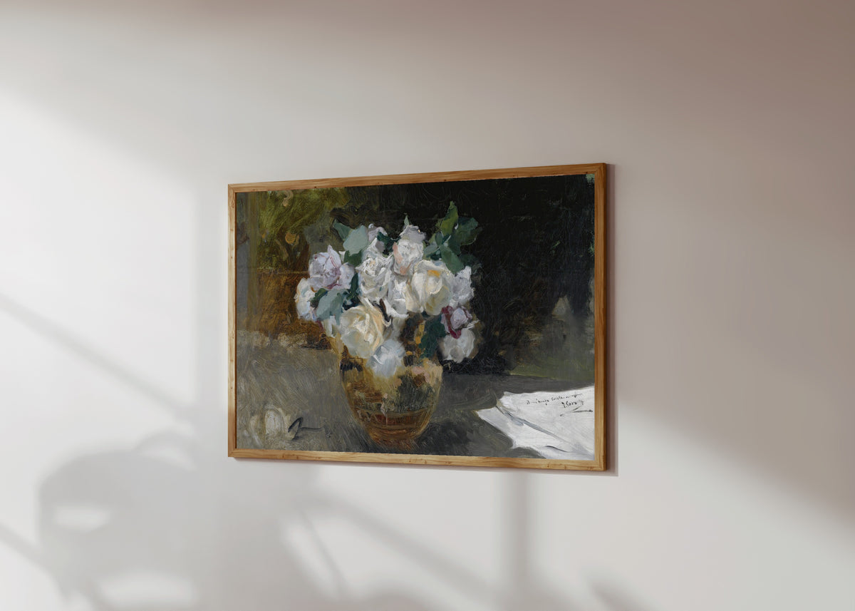 Framed art print of Bouquet of White Roses (Bodegón de rosas blancas) by Joaquín Sorolla, in a light wood frame on a sunlit white wall, seen at a slight angle