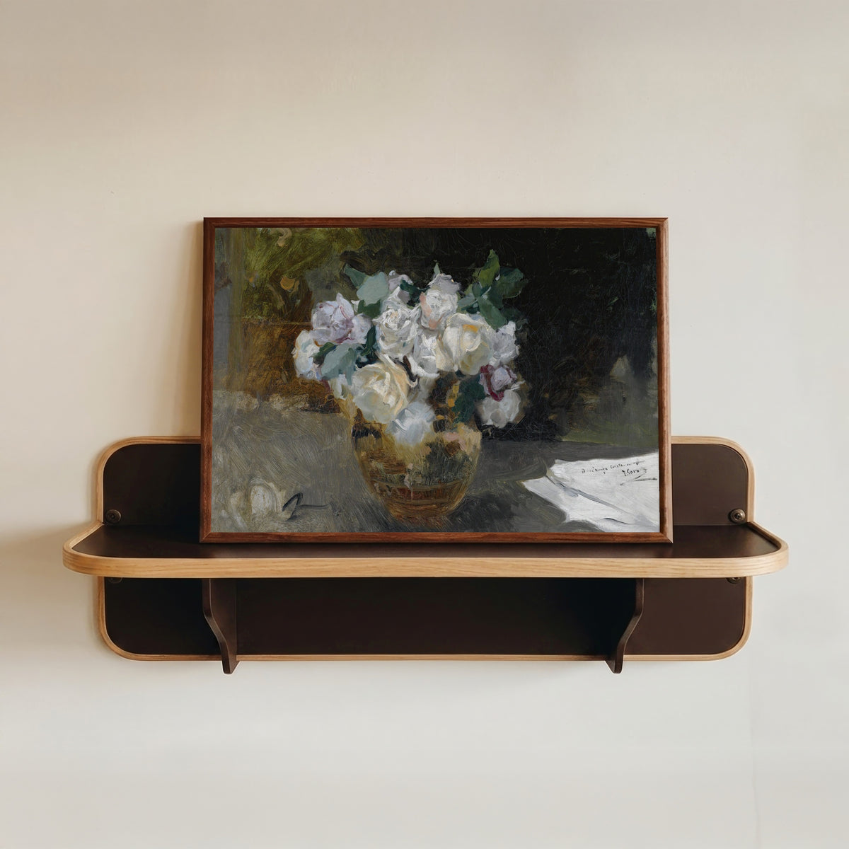 Framed art print of Bouquet of White Roses (Bodegón de rosas blancas) by Joaquín Sorolla, in a dark wood frame resting on a wall shelf