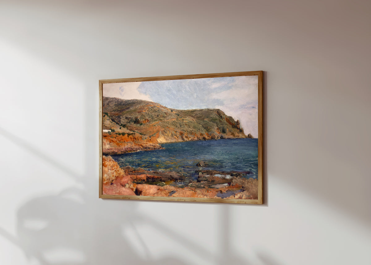 Framed art print of Cape San Antonio, Jávea by Joaquín Sorolla, in a light wood frame on a sunlit white wall, seen at a slight angle