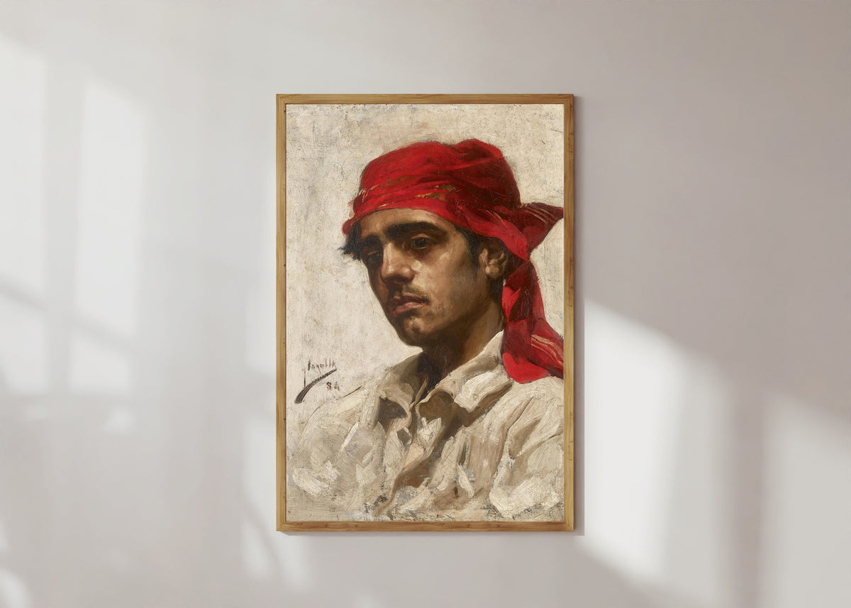 Framed art print of El Palleter by Joaquín Sorolla, in a light wood frame on a sunlit white wall