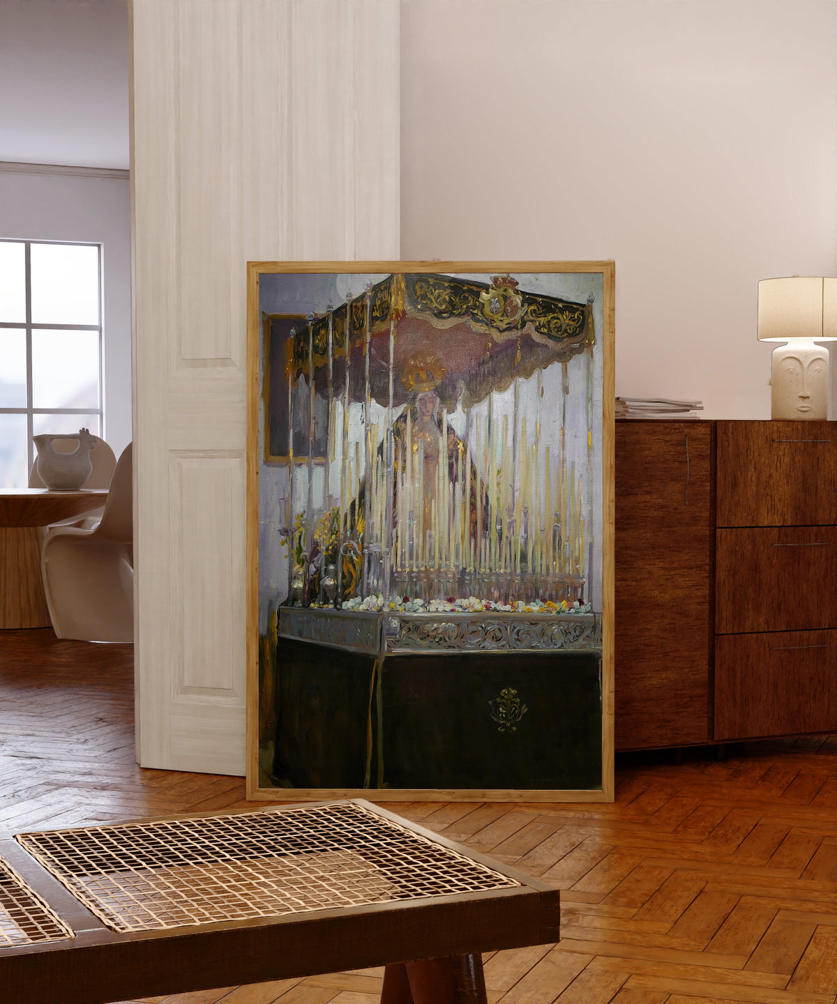 Framed art print of Float of the Virgen del Rosario de Montesión, Seville by Joaquín Sorolla, in a light wood frame leaning in a warm room with a parquet floor