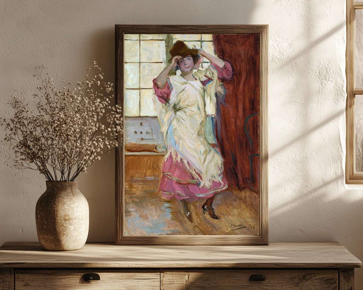 Framed art print of La Bilbainita by Joaquín Sorolla, in a dark wood frame leaning on a rustic console beside dried flowers